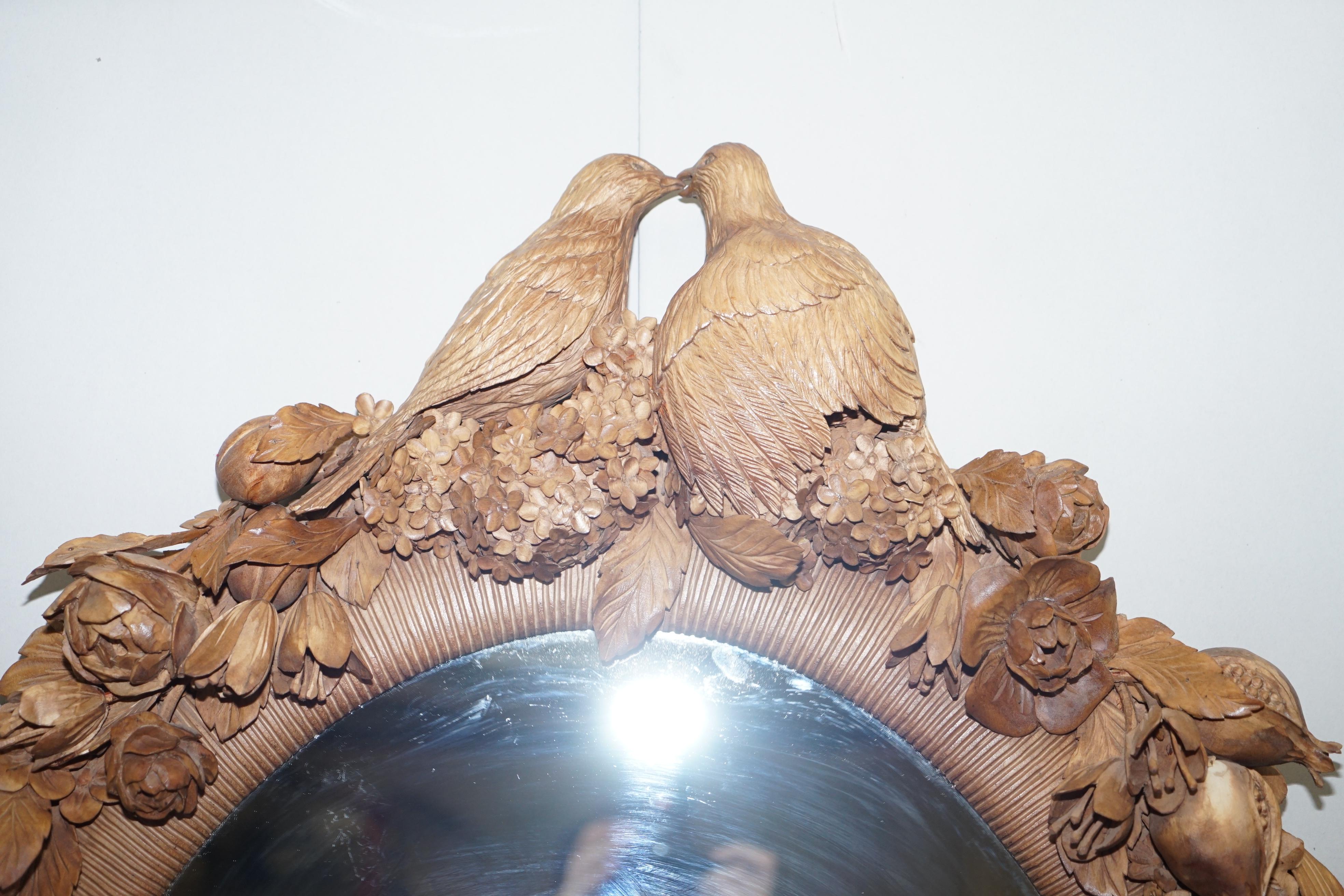 We are delighted to offer for sale this stunning hand carved romantic loves heavily floral carved wall mirror in the style Grinling Gibbons

The mirror is very ornately carved and delicate, the piece of pine you can see on the base has been