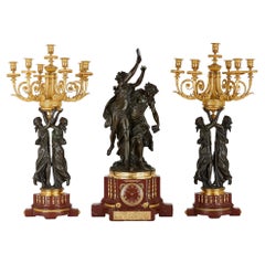 Griotte marble and gilt and patinated bronze clock garniture by Graux