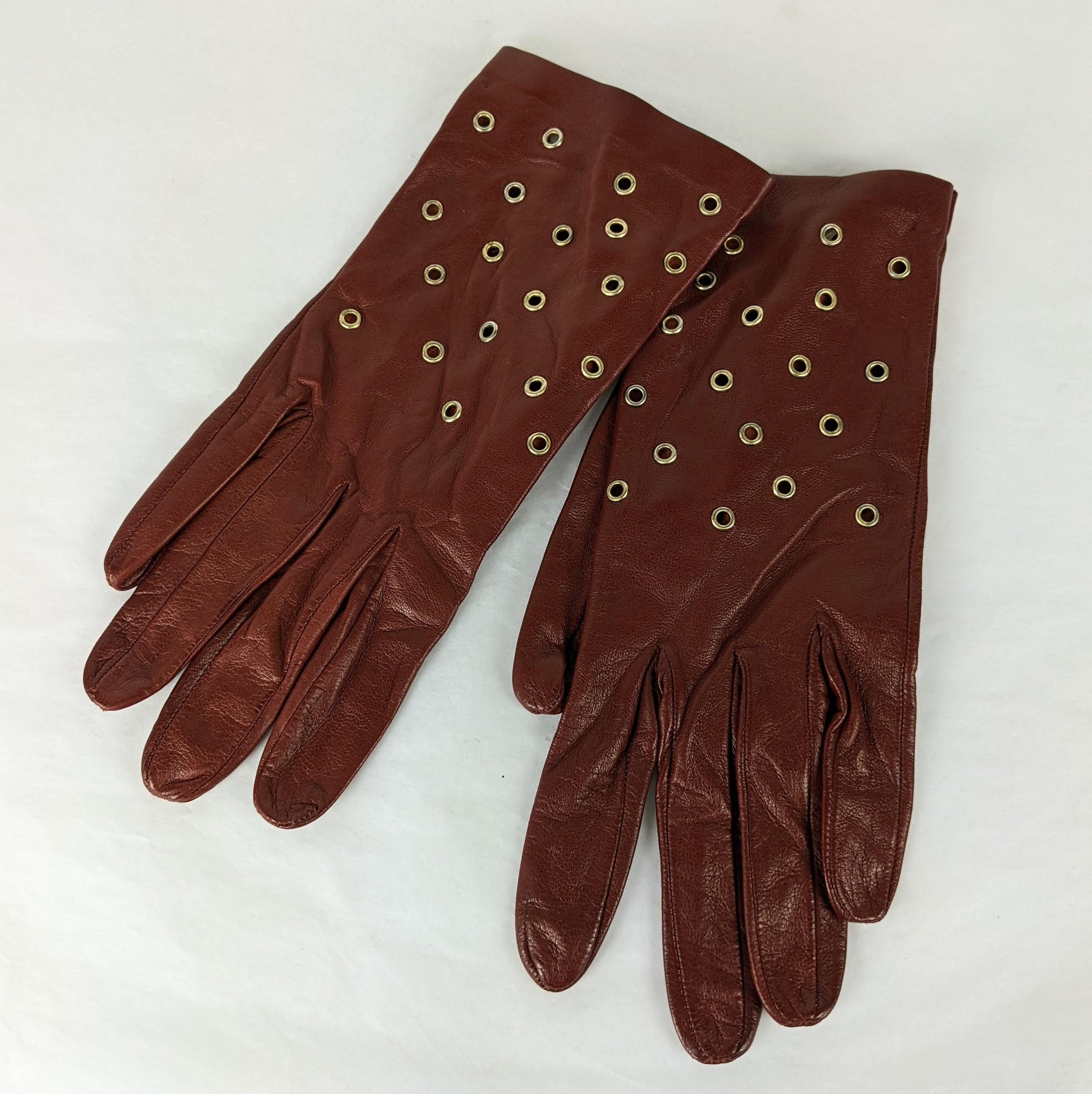 Cool Grommet Set Calf Leather Gloves made for Bloomingdales in Italy made in the style of Azzedine Alaia. Deep brown soft calf with brass toned grommets.
Marked: Size L, size 7,  1990's Italy. 