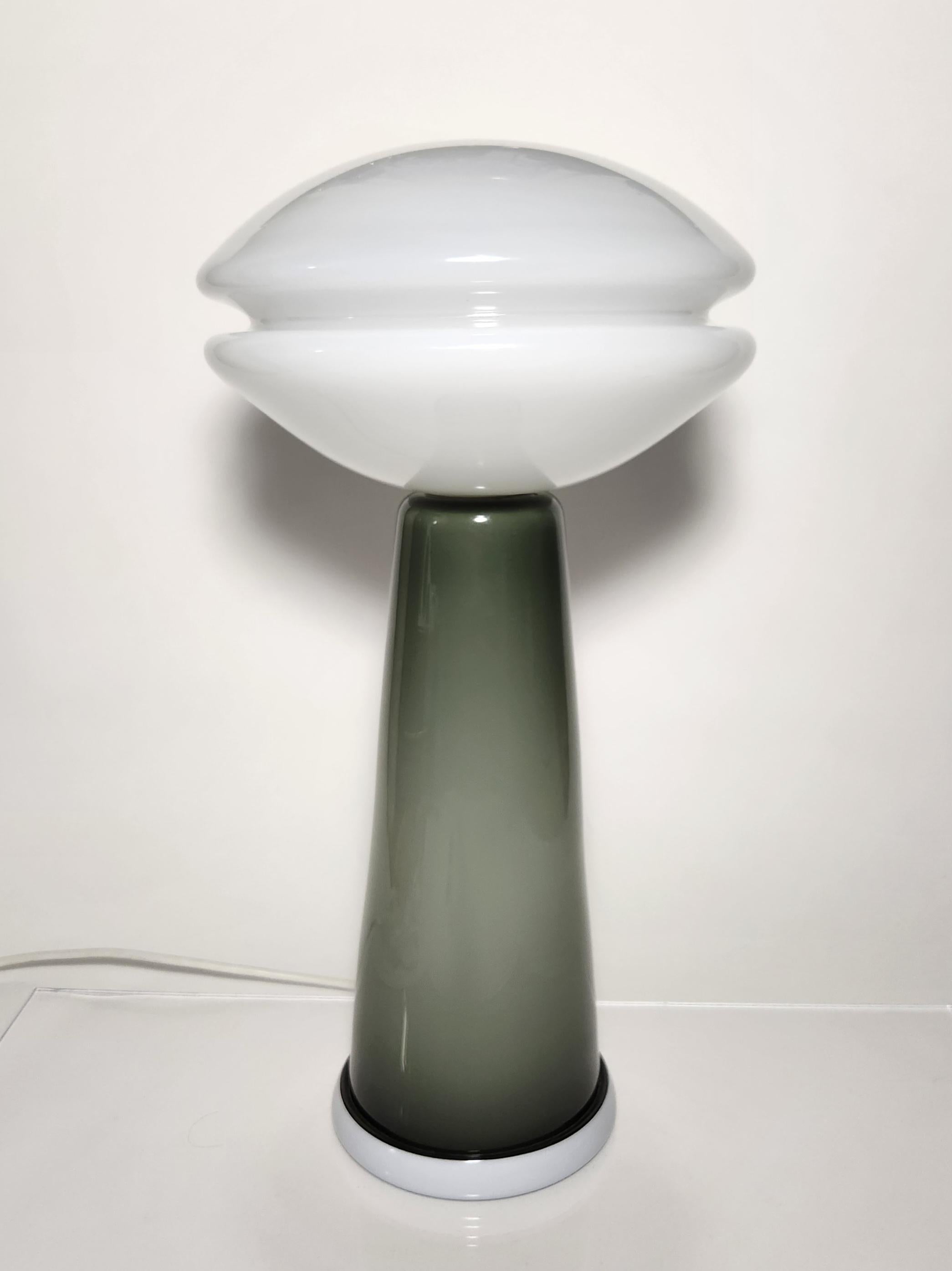 The Groove Series Table Lamps are the newest design in this popular series featuring the signature groove embedded in blown glass forms. Combining a modern aesthetic with minimalist color sensibility, these table lights add a futuristic feel to any
