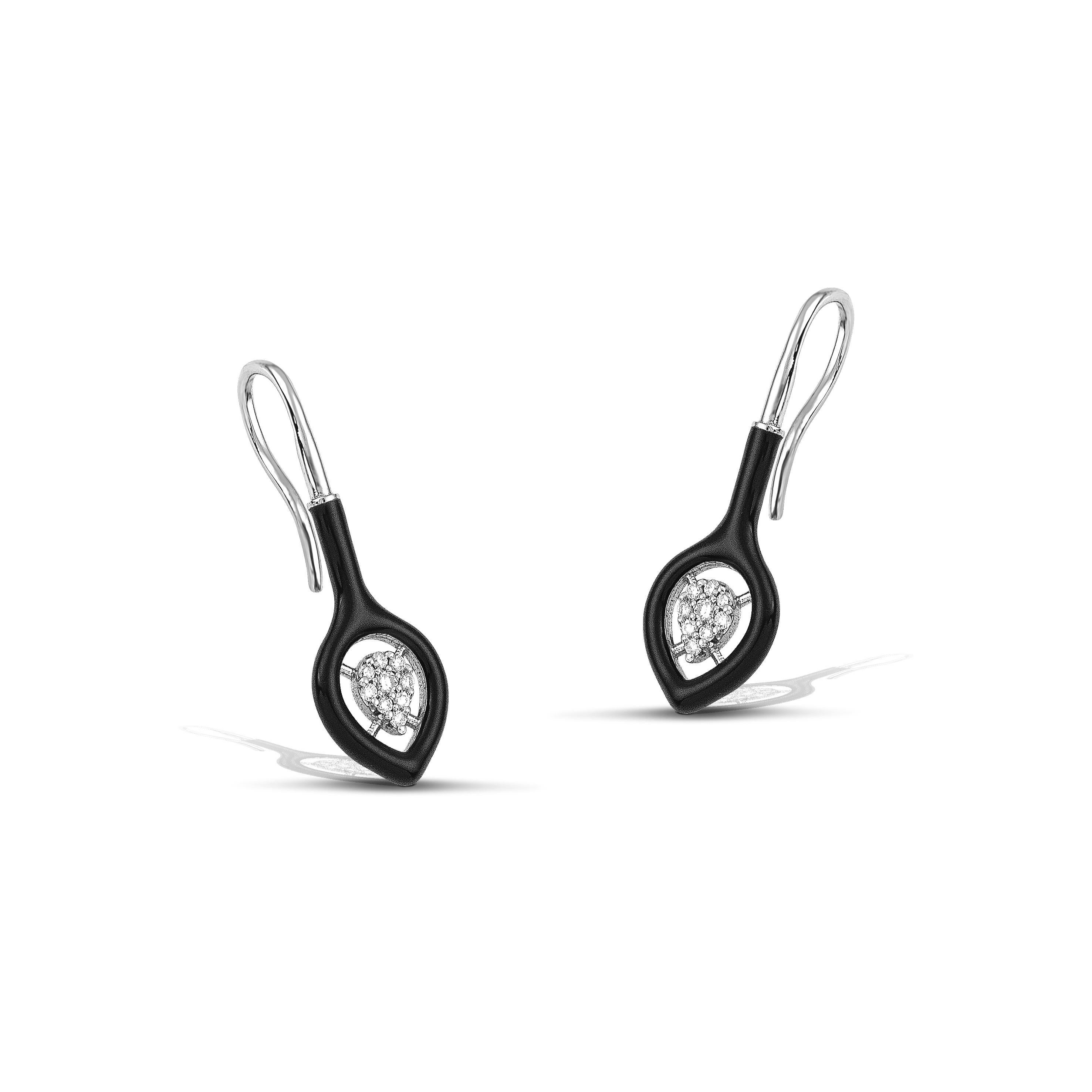 14K gold diamond earrings with a classic black colour accent, the perfect gift for yourself or a loved one.
100% Recycled 14 K White Gold
Diamonds
Black Enamel
Size: 3cm/1,18 inches
Inspiration: In the arts, maximalism, a reaction against