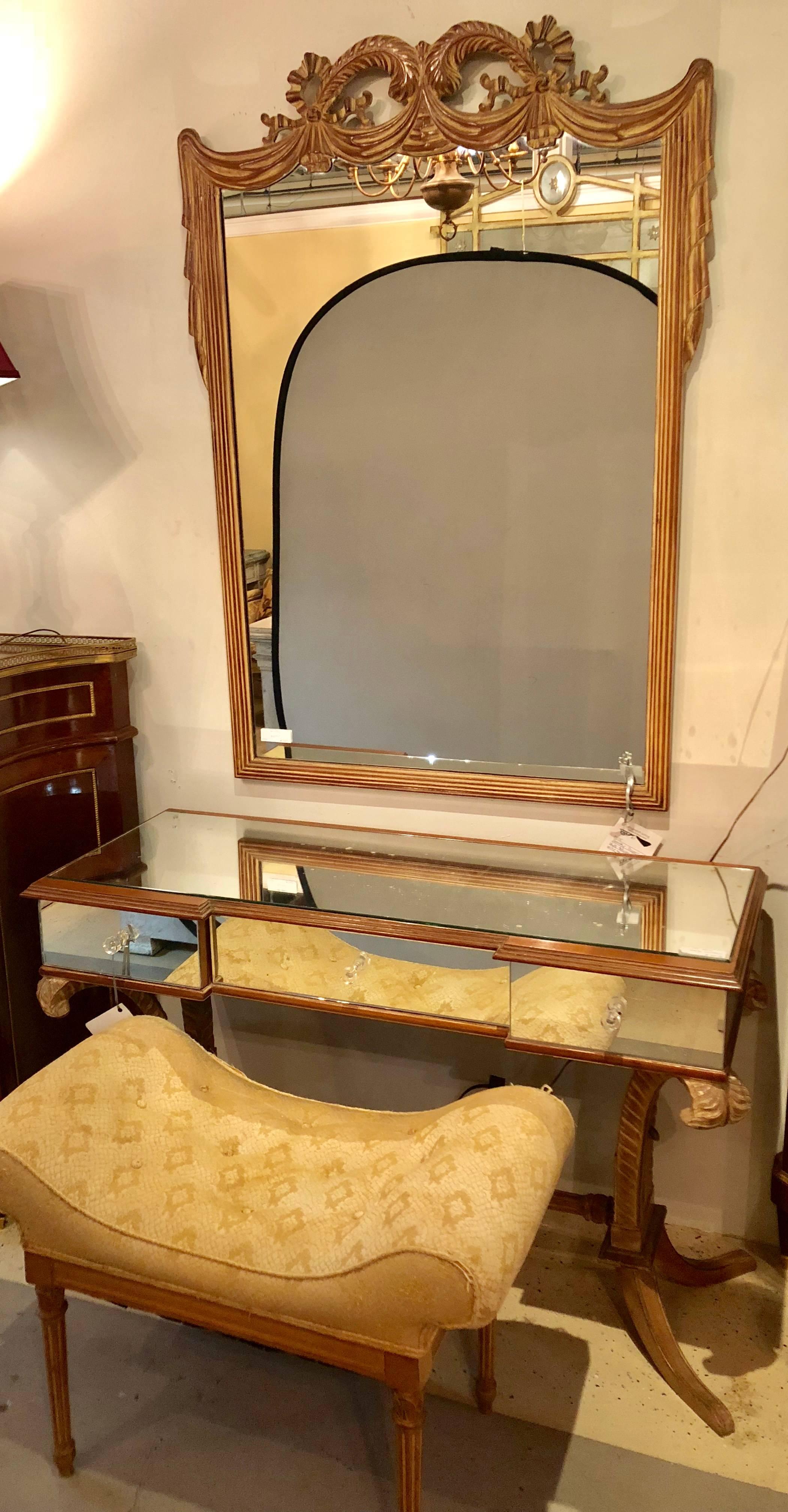 A one of a kind Fleur de Plume Plume three piece set with vanity, matching wall mirror and bench by Grosfeld House. The sprayed legs supporting a Fleur de Plume decorated top. The vanity all around mirrored on top, sides and drawers with crystal