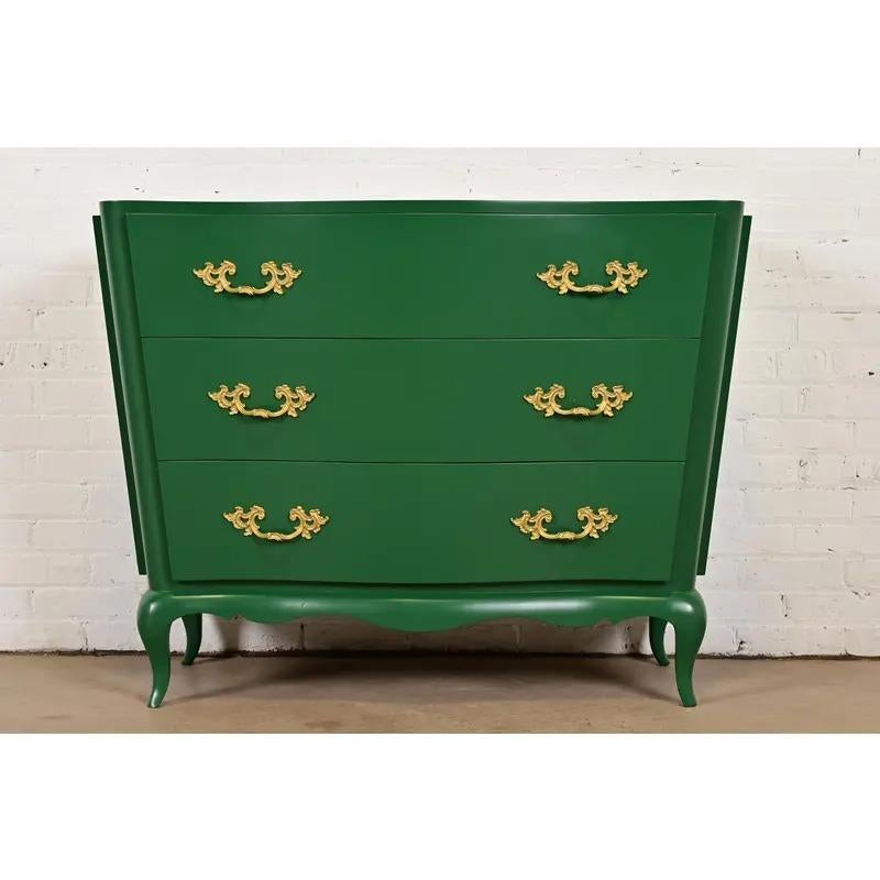 An exceptional French Provincial Louis XV style serpentine front three-drawer dresser or chest of drawers

By Grosfeld House

USA, Circa 1940s

Green lacquered mahogany, with original brass hardware.

Measures: 43