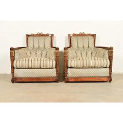 Grosfeld House French Regency Louis XVI Carved Walnut Bergere Armchairs, Pair