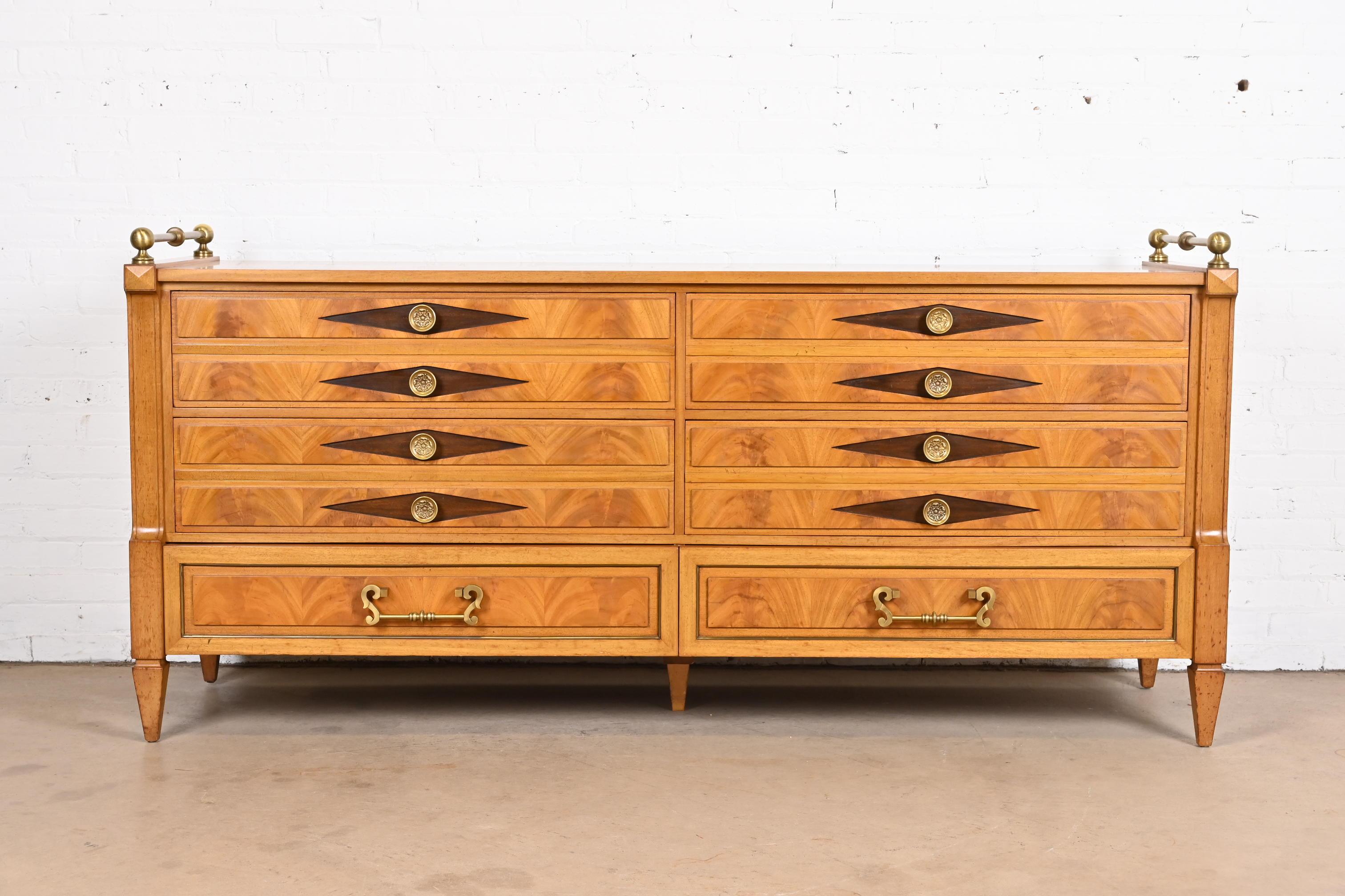 A gorgeous Hollywood Regency or Neoclassical long dresser, sideboard, or credenza

By Grosfeld House

USA, Mid-20th Century

Beautiful book-matched flame mahogany, with original brass hardware and gallery.

Measures: 78