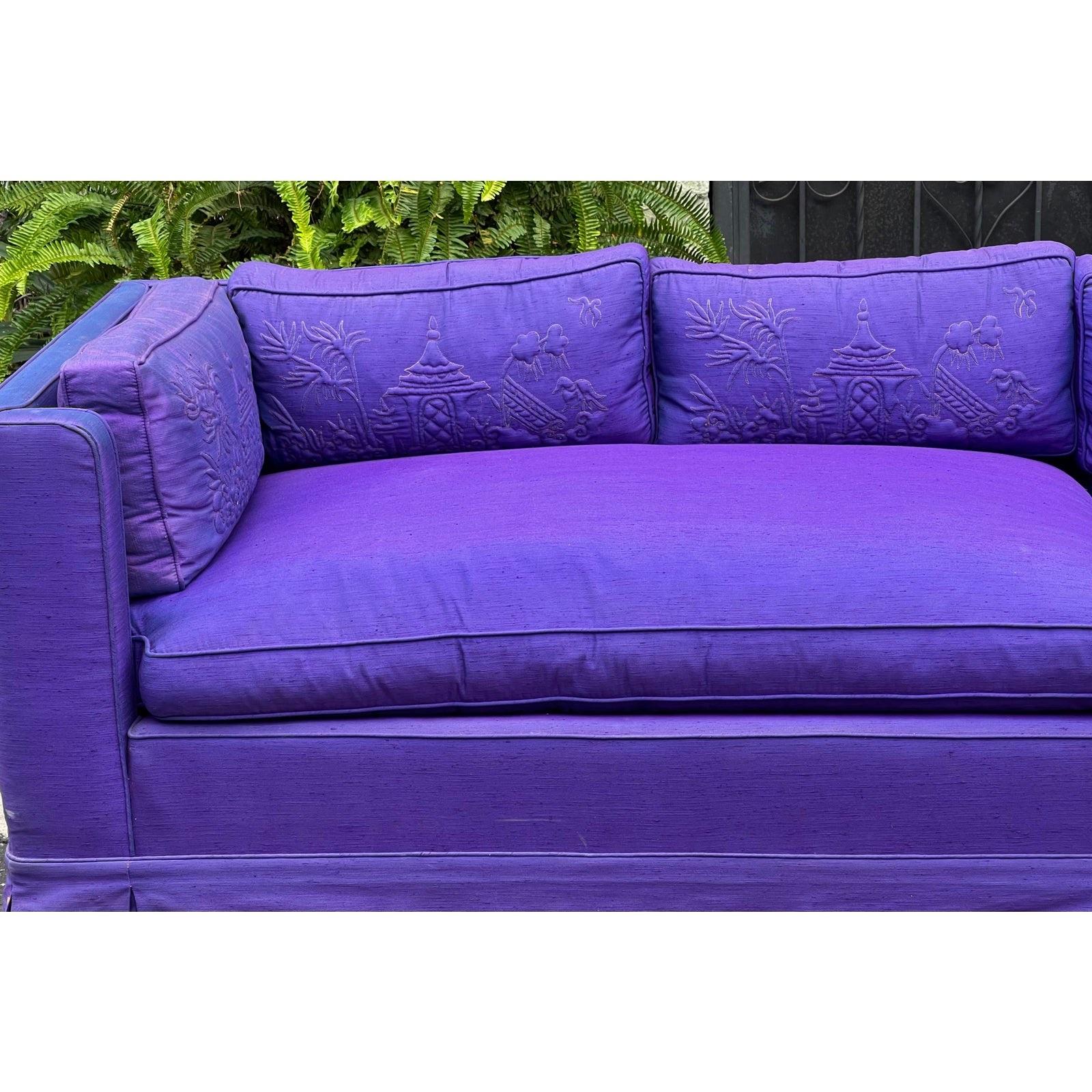 Grosfeld House Hollywood Regency Mid-Century Modern 9' long low sofa. The color is an alexandrite purple with hues of blue in certain light. Features Chinese embroidered cushion with luxurious down fill. No holes or stains. Light fading.