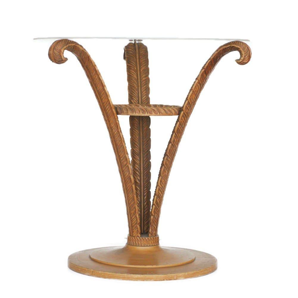 Art Deco carved wood plume side table by Grosfeld House made of three wood plume leaves opening up from the center of the base to the border of the glass top. This table has highly detailed carved accents and trim with a plate glass