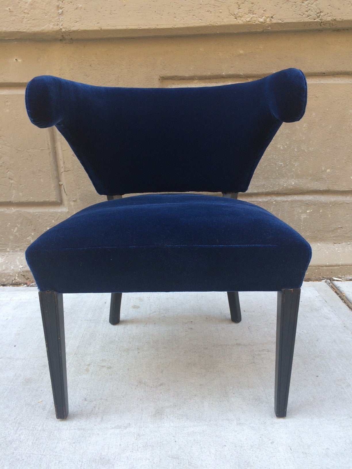 Grosfeld House side chair. Upholstered in blue velvet with black lacquered legs. Style of Paul Laszlo.