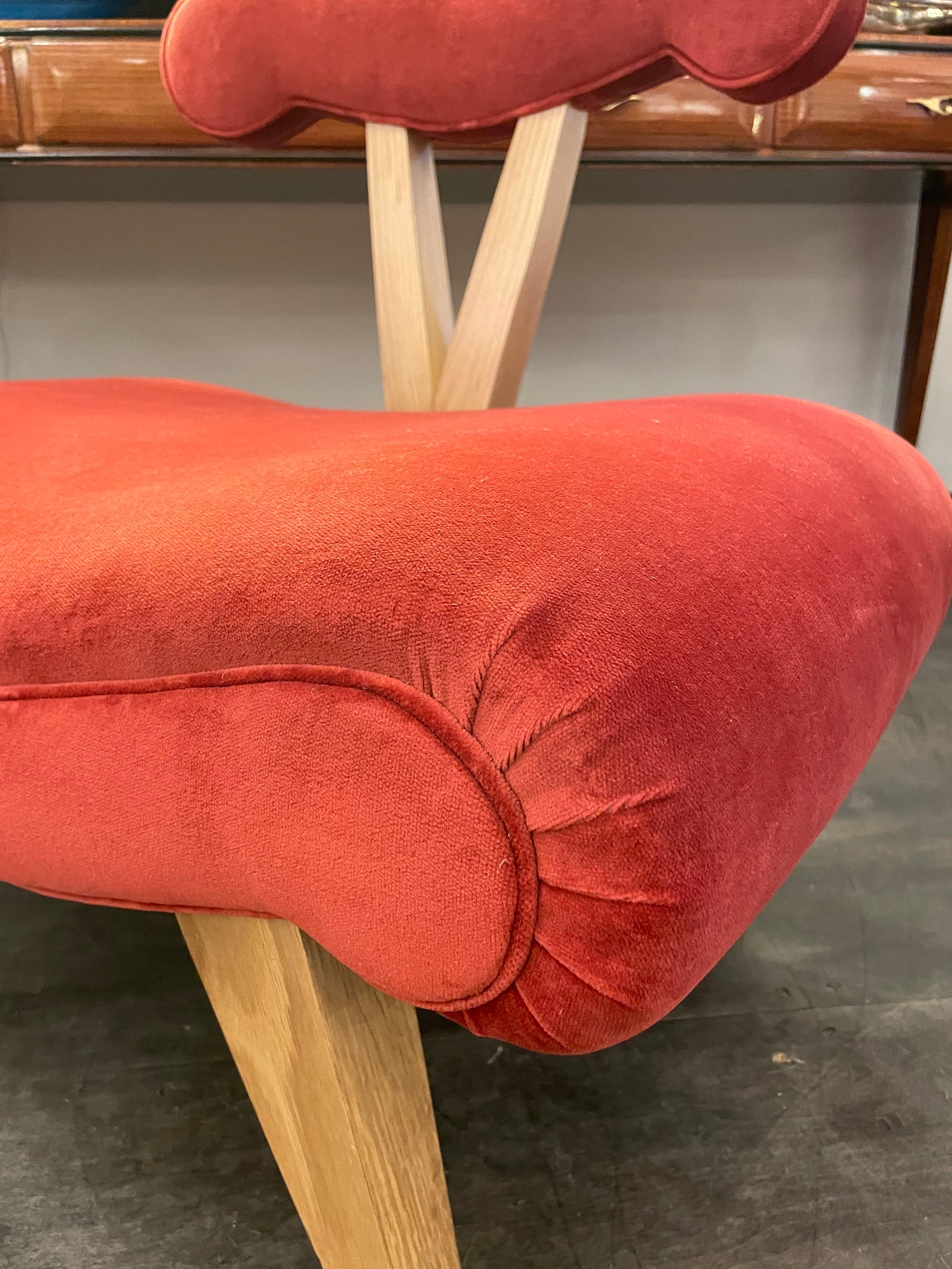 We have 4 of thee iconic Grosfeld House slipper chairs in the Hollywood Regency style, made later than the 1940's. In pristine, almost never used condition, in 4 different velvet colors, making a whimsical grouping. Priced and Sold individually -