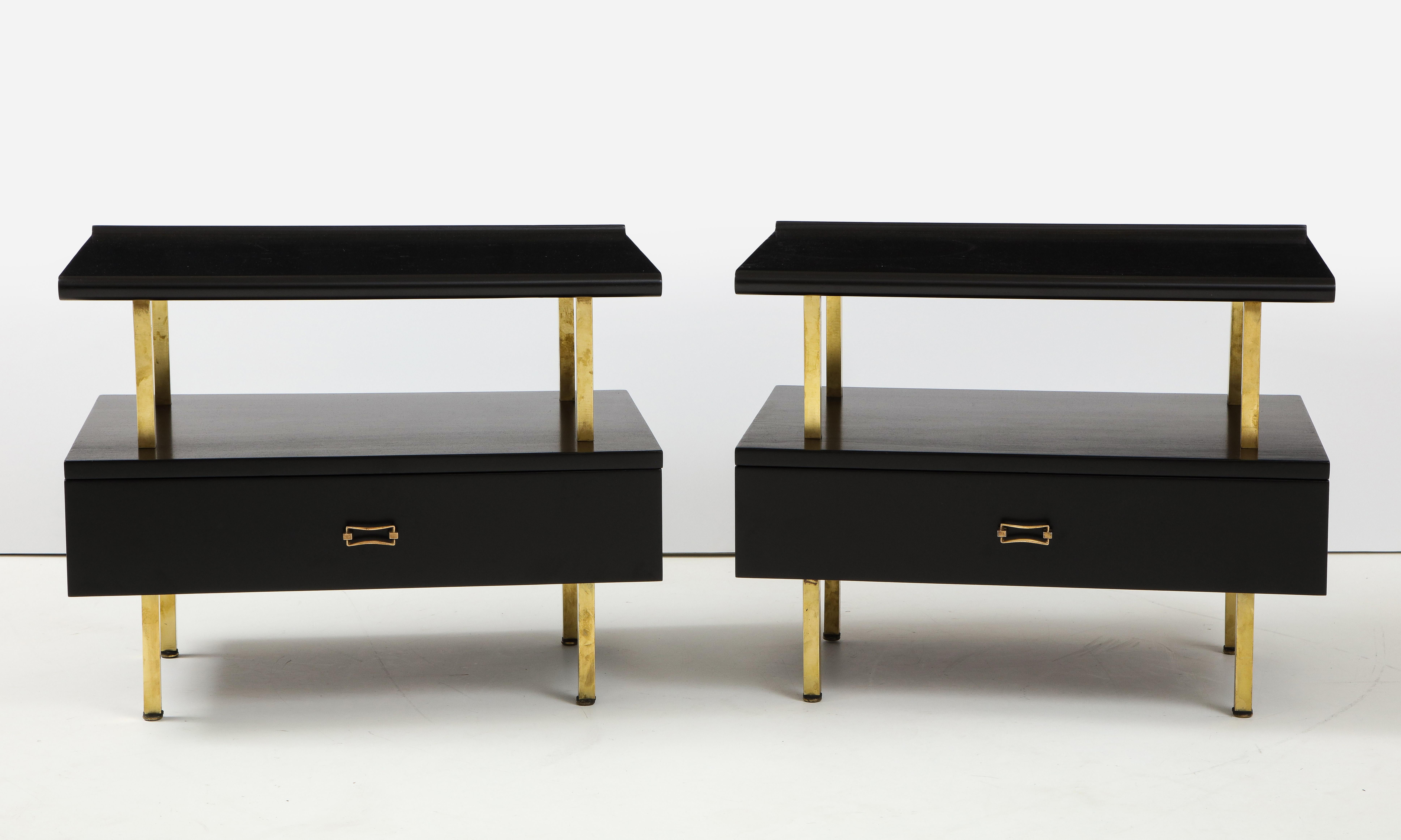 Stunning pair of 1960's Mid-Century Modern brass and black lacquer two tier end tables with brass hardware, fully restored with minor wear and patina due to age and use.