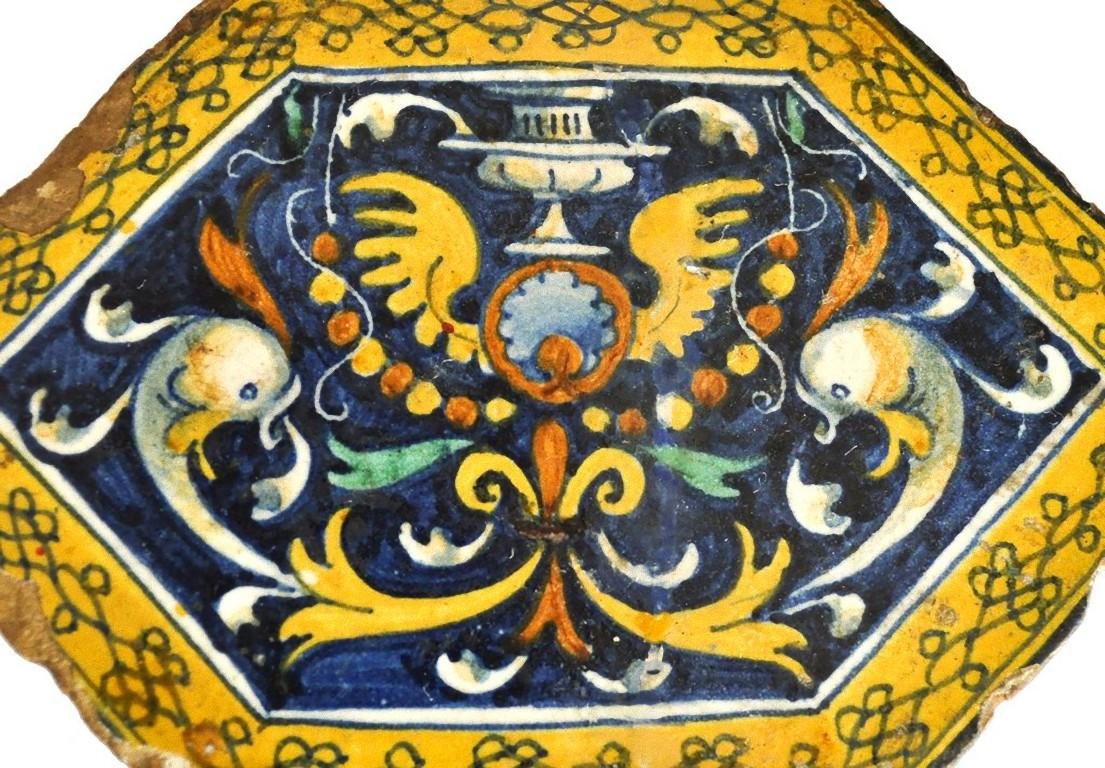 This grotesque ceramic, designed by Pinturicchio for the furnishing of Pope Alexander VI's apartment in Vatican (1492-1495), demolished by his successor Julius II. 

This antique Majolica is a masterpiece of the decorative art, realized in the