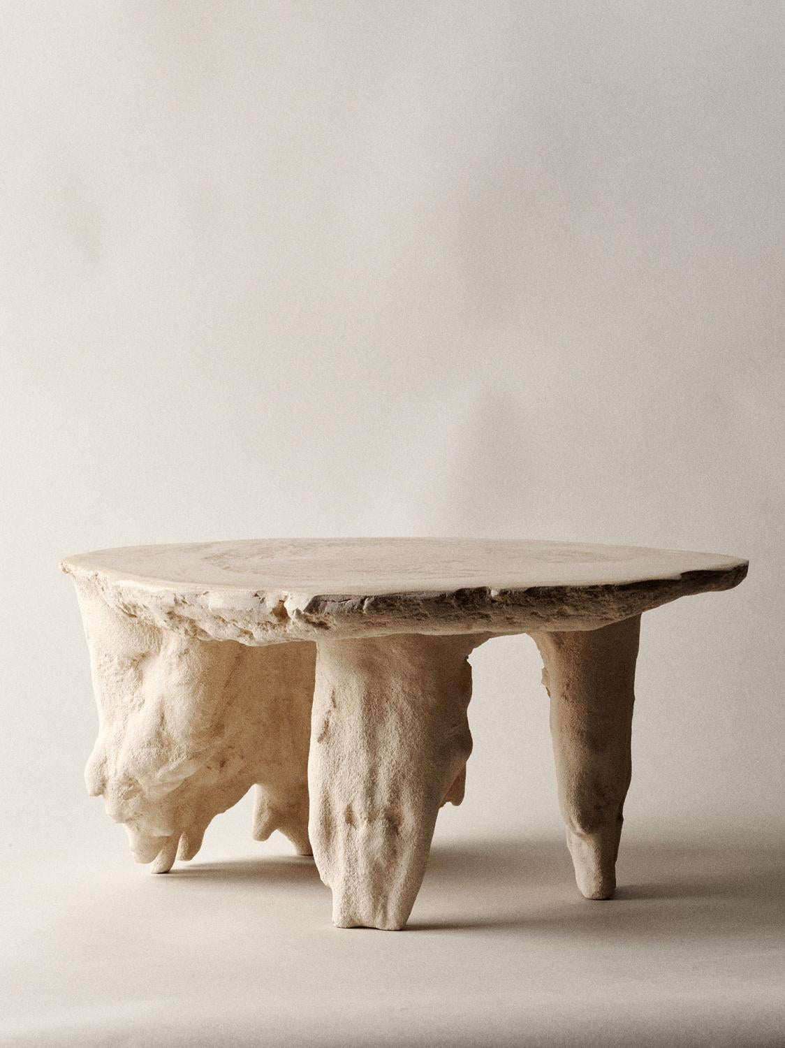 Grotto serving plate by Kajsa Melchior.
Fictive Erosion collection
Dimensions: H approx. 20 cm
 Ø: Approx. 40 cm
Materials: Sculpted in sand by human body pressaure.
 Developed in Jesmonite, blended with bath stone minerals.
 
Fictive Erosion