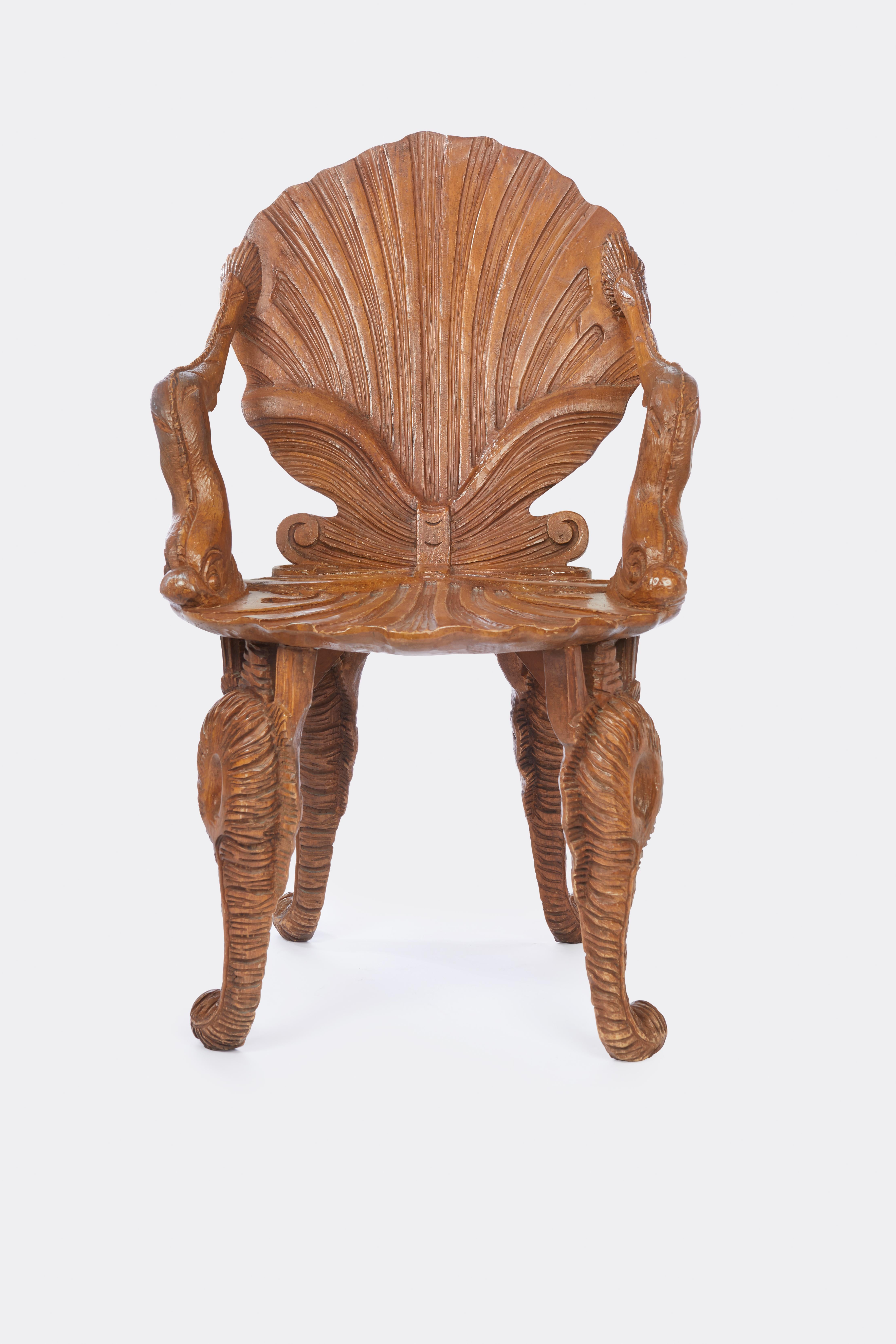 Hand-carved fruitwood frames with stylized dolphin-form arm from the mid 1900s. The chairs has very high quality and are unusually generous in proportions. The height of the back is 39”, the overall width is 24”; the overall depth is 24” and the