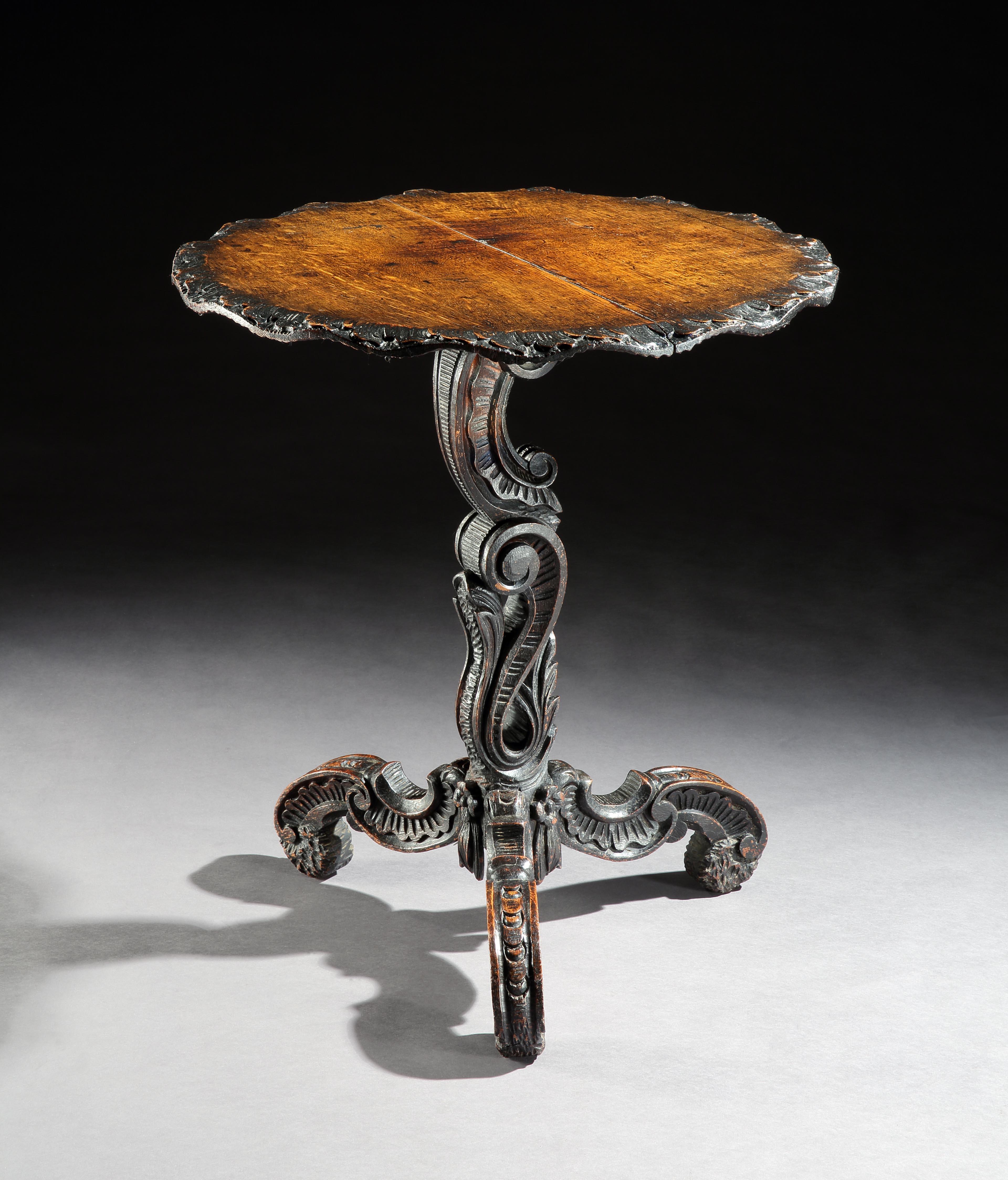 Lovely, carved detailing the the edge of the top and rococo scrollwork stem and feet which incorporate shell detailing inside the scrolls
This table is crisply carved with characteristic grotto ornamentation creating the form with the scrollwork