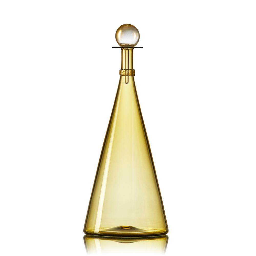 Set of 3 large hand blown glass bottles in a composition of geometric forms inspired by decorative decanters of Mid-Century Modern design. Coordinated neck-wraps and blown glass stoppers are finished with luminous gold-leaf. Offered in a selection