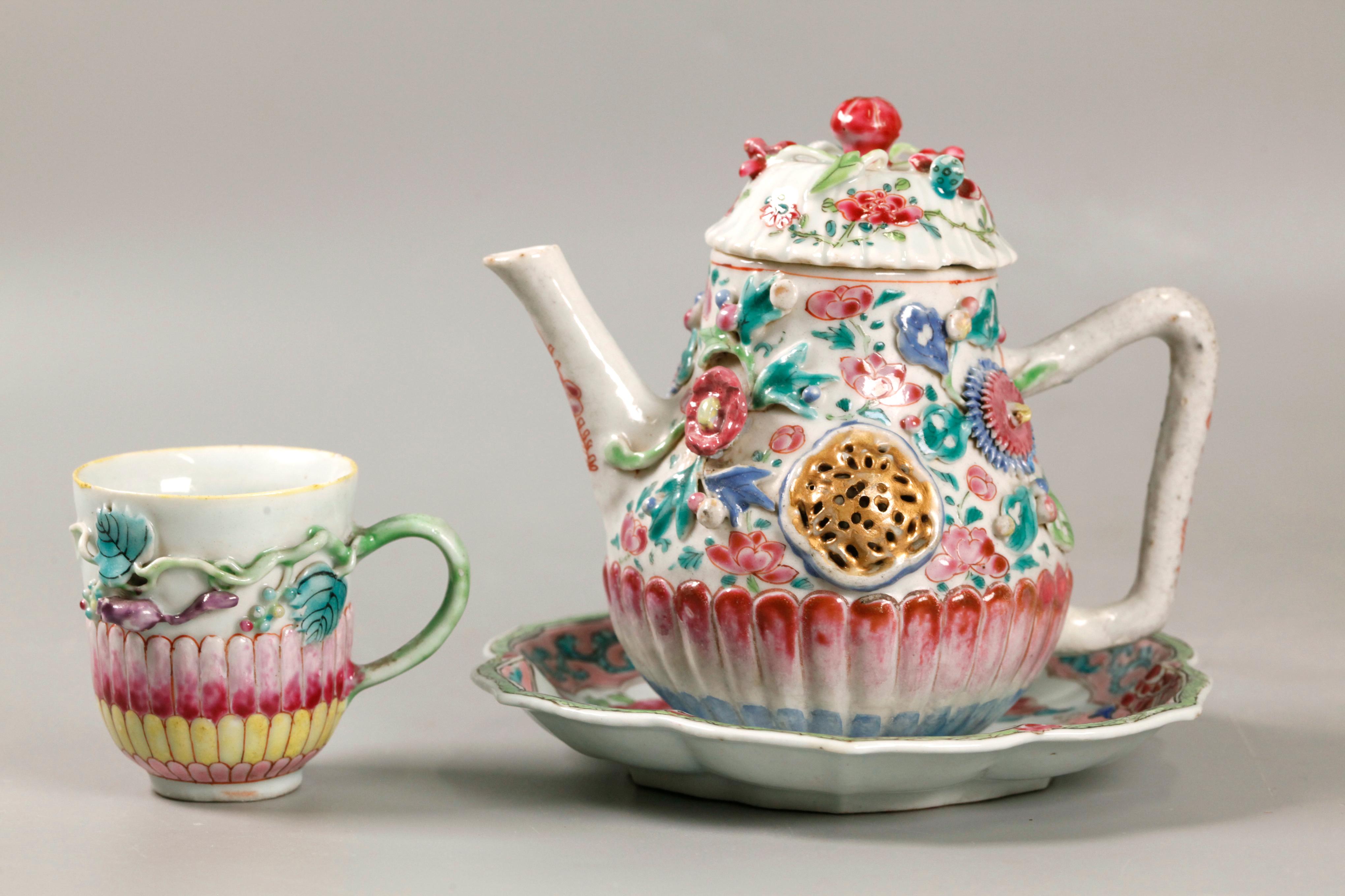 3.8in(D) x 5.75in(W) x 4.9in(H) are the dimensions of the teapot; teapot and cup are decorated with floral motif in relief 