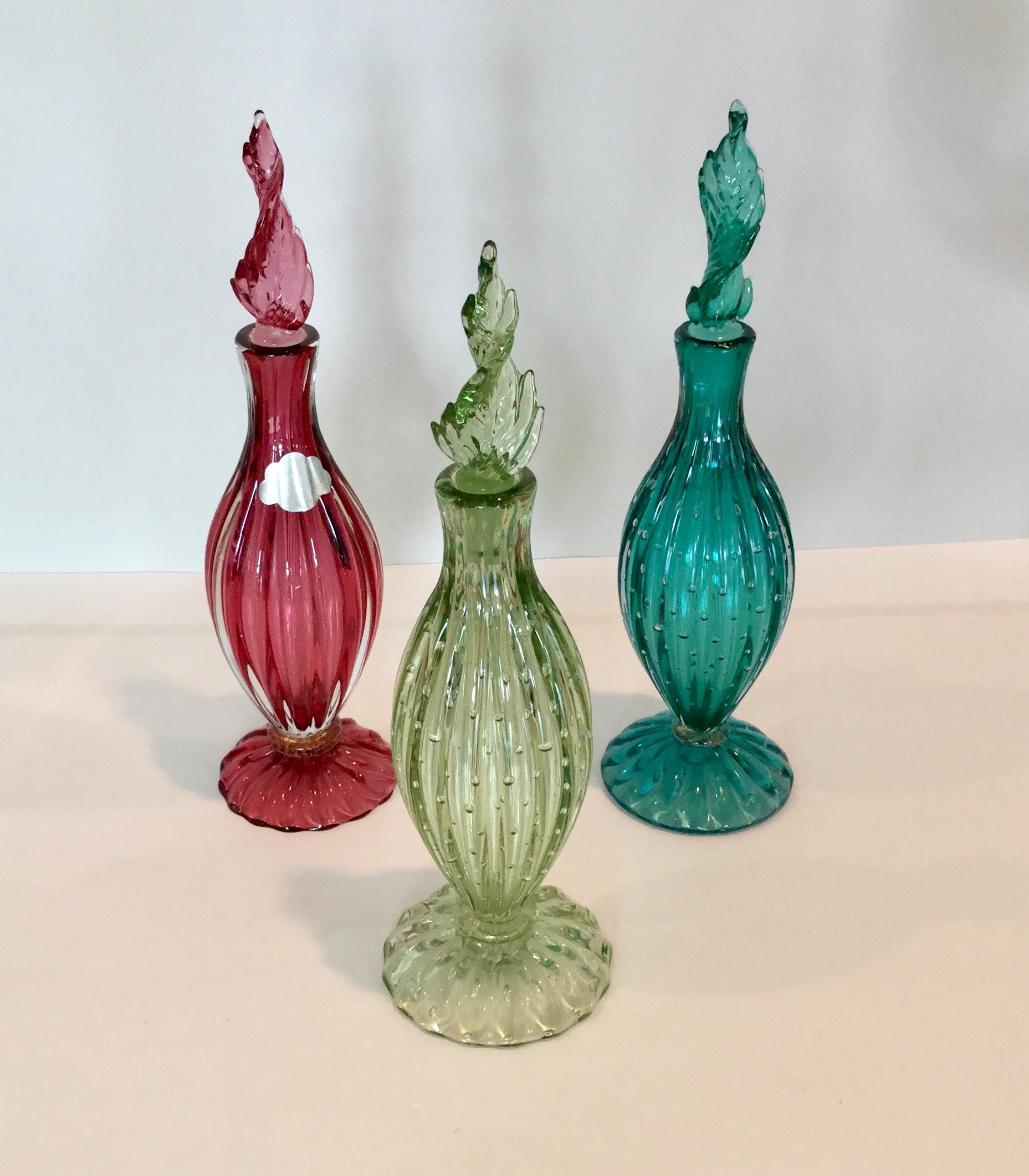 Group of 3 Murano decanters by Alfredo Barbini. 1 retains an original label. Great collector display with seldom seen colors.