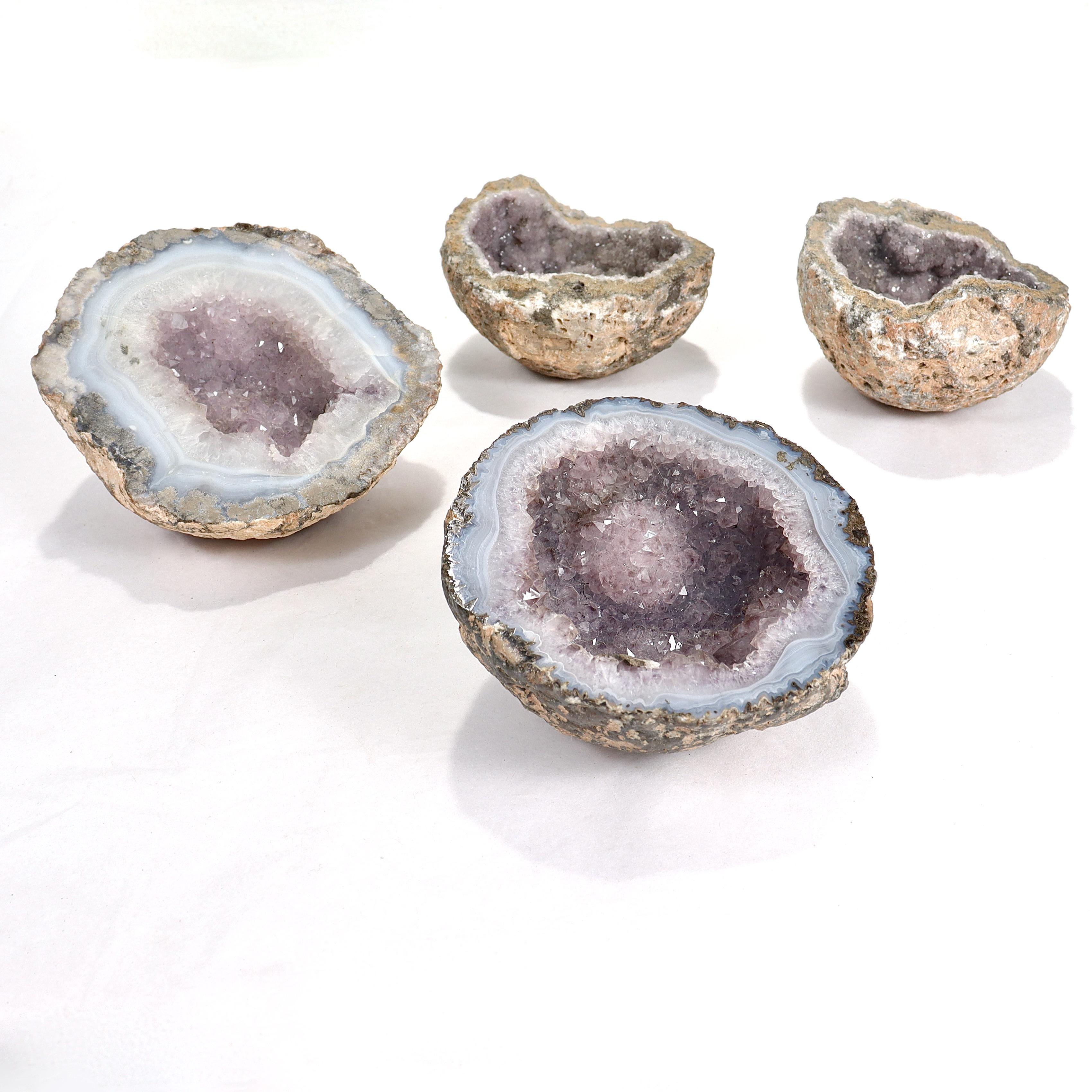 A fine set of 4 amethyst geodes.

The group consists of one pair of complementary halves of the same geode and 2 other examples.

The complementary pair is unpolished, and the other 2 examples are polished

Simply a great group of amethyst