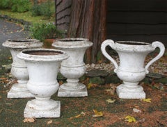 Group of 4 Cast Iron Regence Style Urns