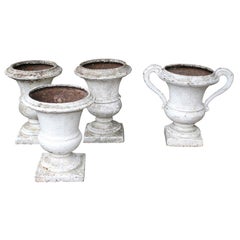 Group of 4 Cast Iron Regence Style Urns