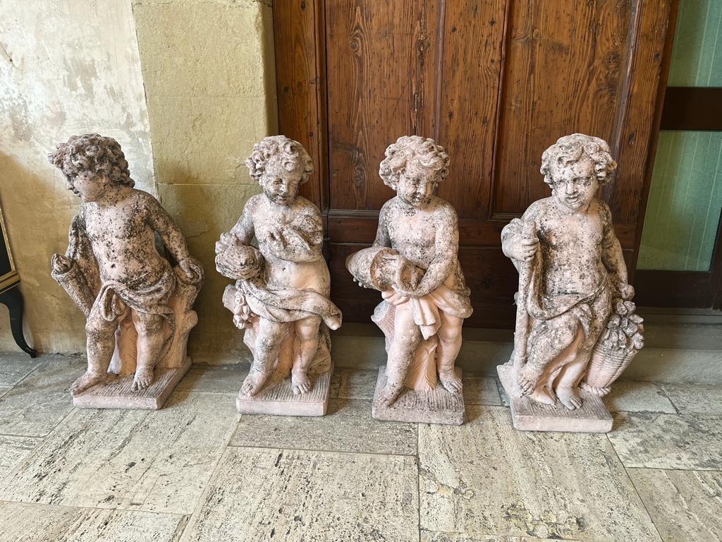 Mid-20th Century Group of 4 grit Putti depicting the 4 Elements: Sky, Earth, Air and Fire, 1930s For Sale