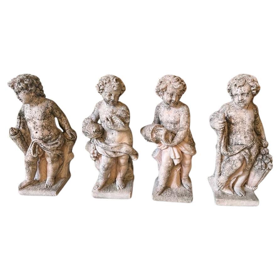 Group of 4 grit Putti depicting the 4 Elements: Sky, Earth, Air and Fire, 1930s For Sale