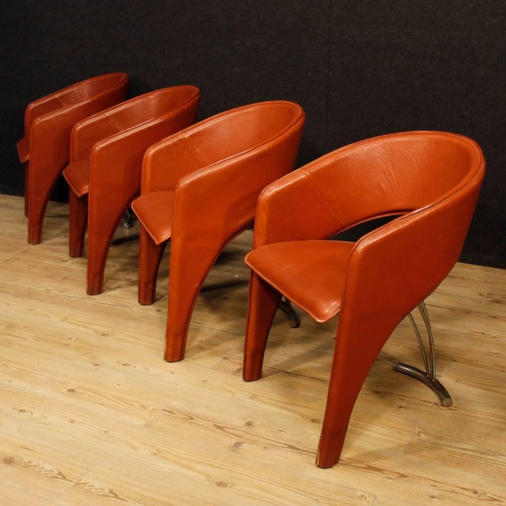 Group of four Italian chairs of the 20th century. Italian design furniture in metal and leather of beautiful line and pleasant decor. Armchairs of good comfort with padding in good condition. Seat height of 46 cm. Ideal furniture to be inserted in a