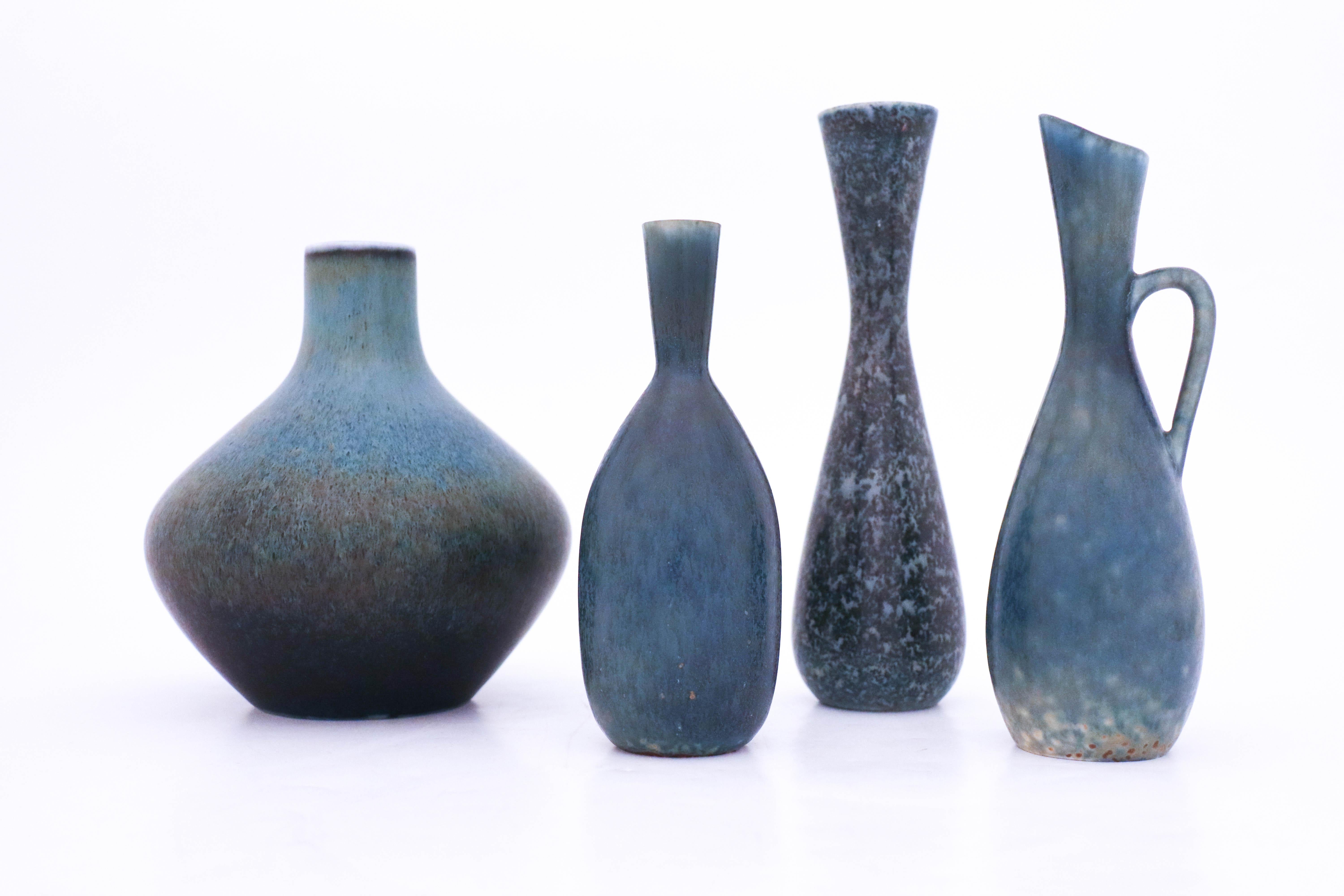 A group of four vases designed by Carl-Harry Stålhane at Rörstrand. They are 16-21 cm high and all of them are marked as 1st quality. They are in very good condition.