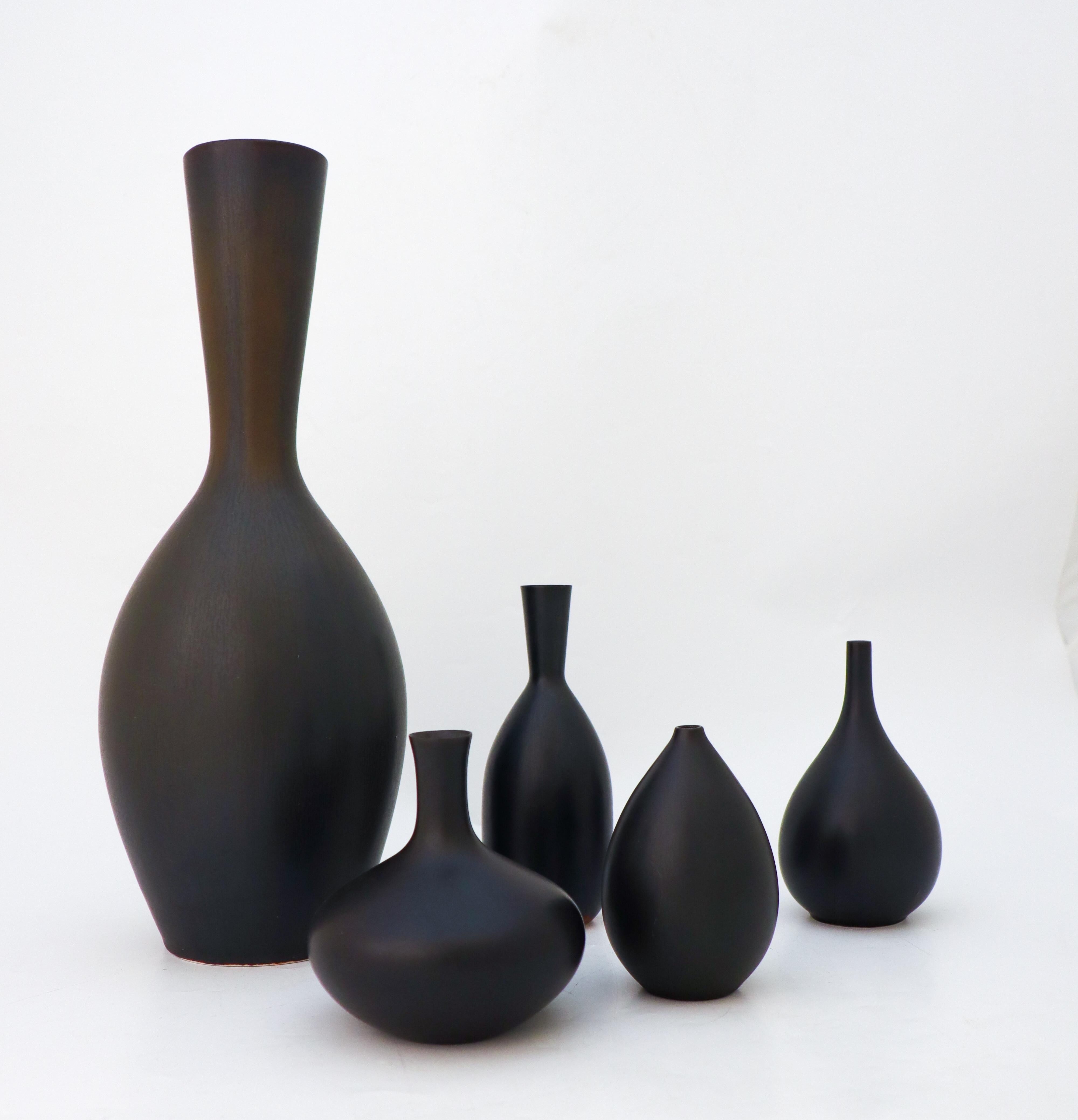 A group of five black vases designed by Carl-Harry Stålhane at Rörstrand. The vases are between 10 - 34 cm high and in excellent condition except from some minor marks and scratches. Three of the vases are marked as 2nd quality and two of them are