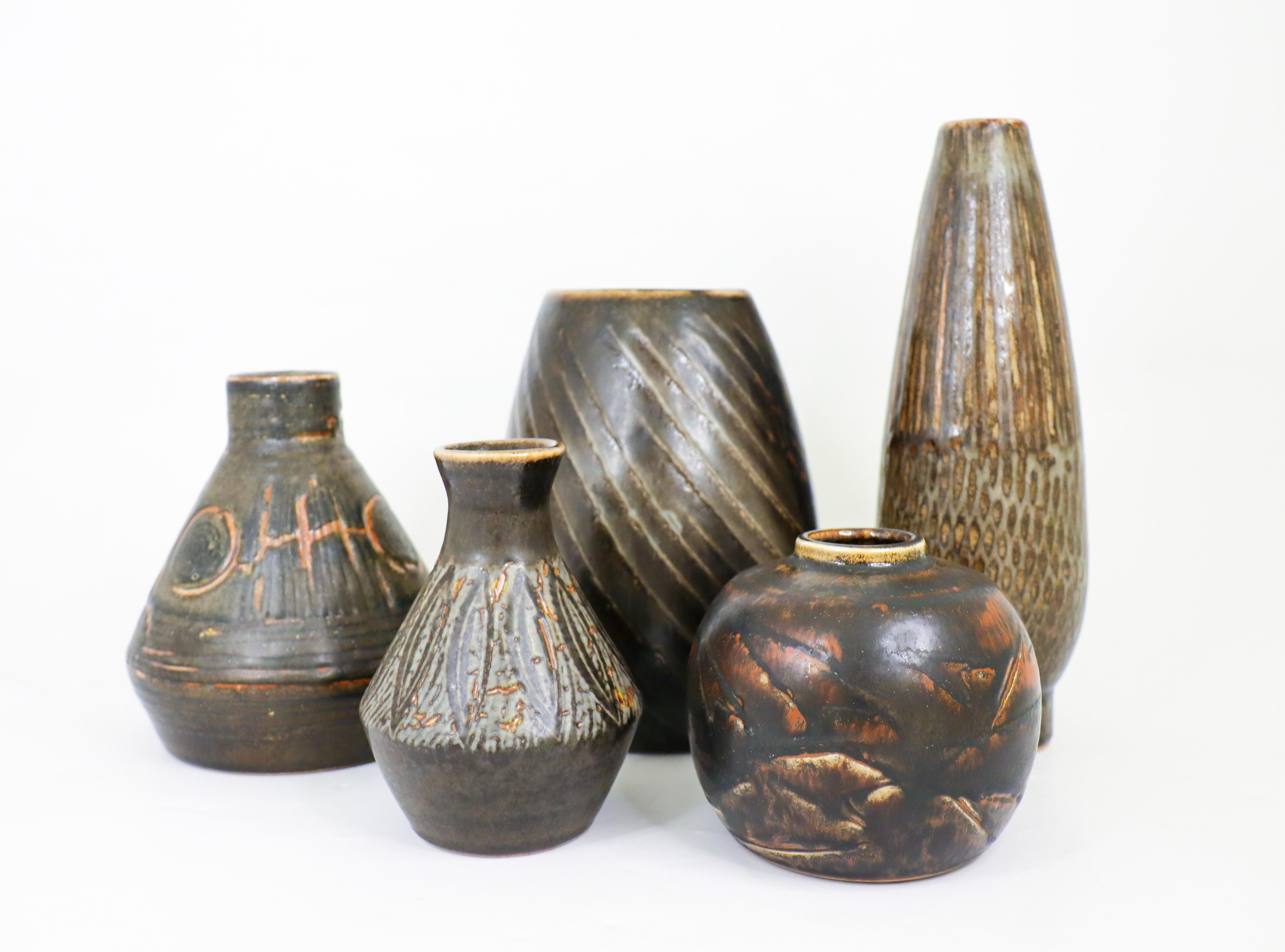 A group of five dark brown / black vases with a stunning glaze designed by Carl-Harry Stålhane at Rörstrand in the 1950s and 1960s. The vases are between  11.5 - 2475 cm high and in excellent condition. Three of the vases is 2nd quality and the