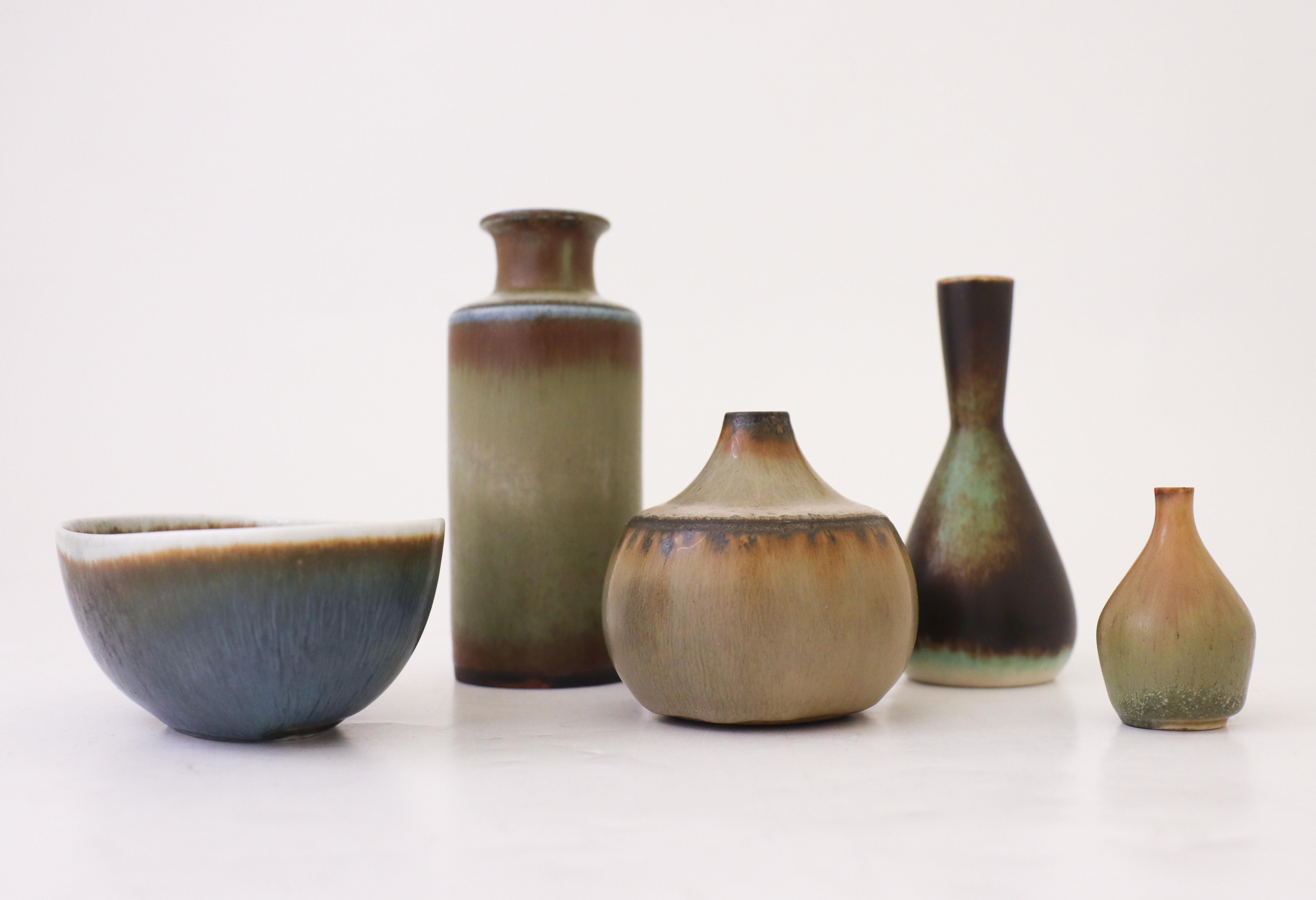 A group of four vases and one bowl designed by Carl-Harry Stålhane at Rörstrand. The vases are between 5 - 12,5 cm high and in excellent condition. They are all in excellent condition and first quality. Two of the vases are unique vases by