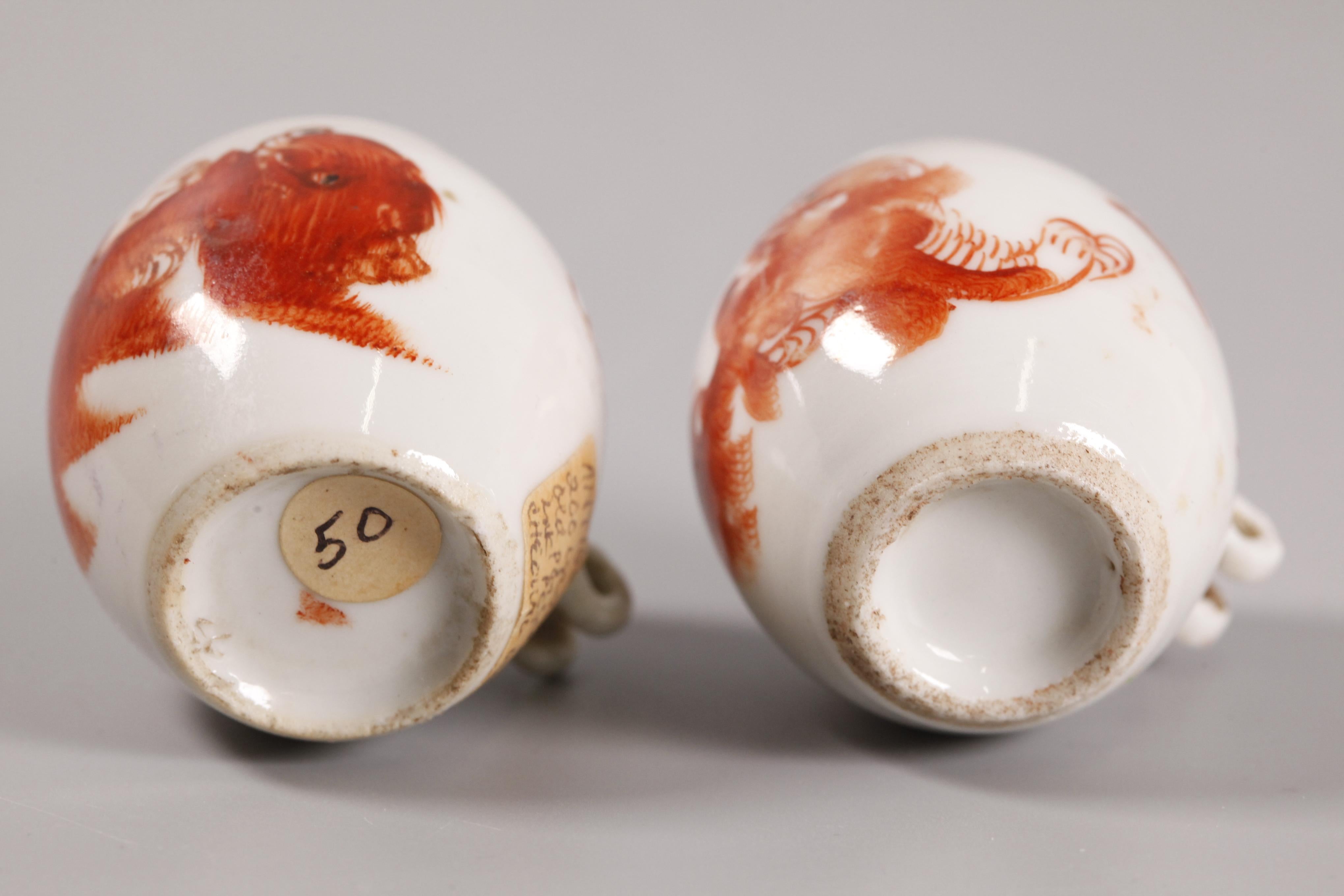 each decorated with a copper red foo lion/dog; 2in(D) x 2in(W) x 2.5in(H) are the dimensions of the tallest porcelain bird feeder 