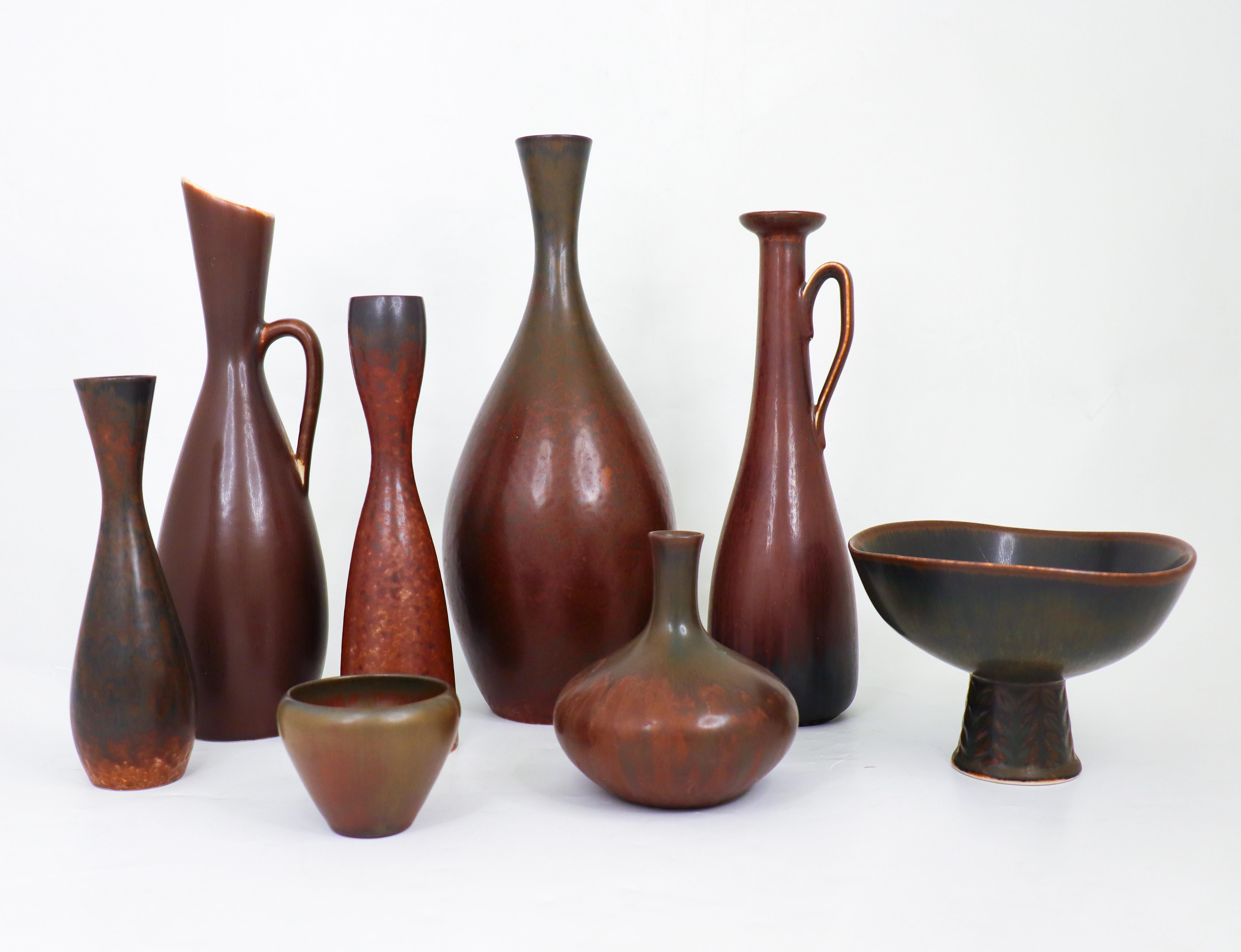 A group of seven vases and bowls by Carl-Harry Stålhane, two bowls at Rörstrand and one vase by Gunnar Nylund in the 1950s and 1960s. The vases are between 6.5 - 25.5 cm high and in excellent condition. They are between 5 - 28.5 cm high and in