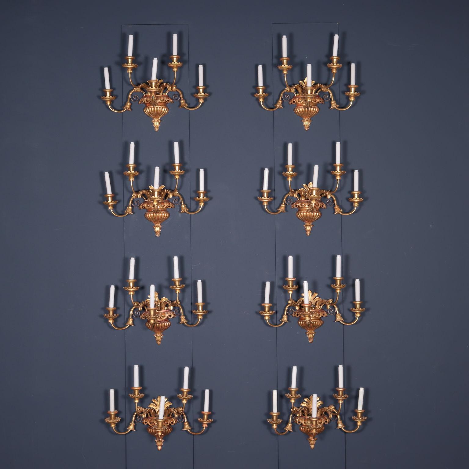 Group of eight Viennese Biedermeier appliques, the support is made up of an element in the shape of a poded vase, with a floral corolla forming the lower part; the upper edge is also poded and perforated. Leaf elements and five candle-holding arms