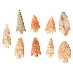 Group of 9 Arrowheads Carved From Various Types of Stone