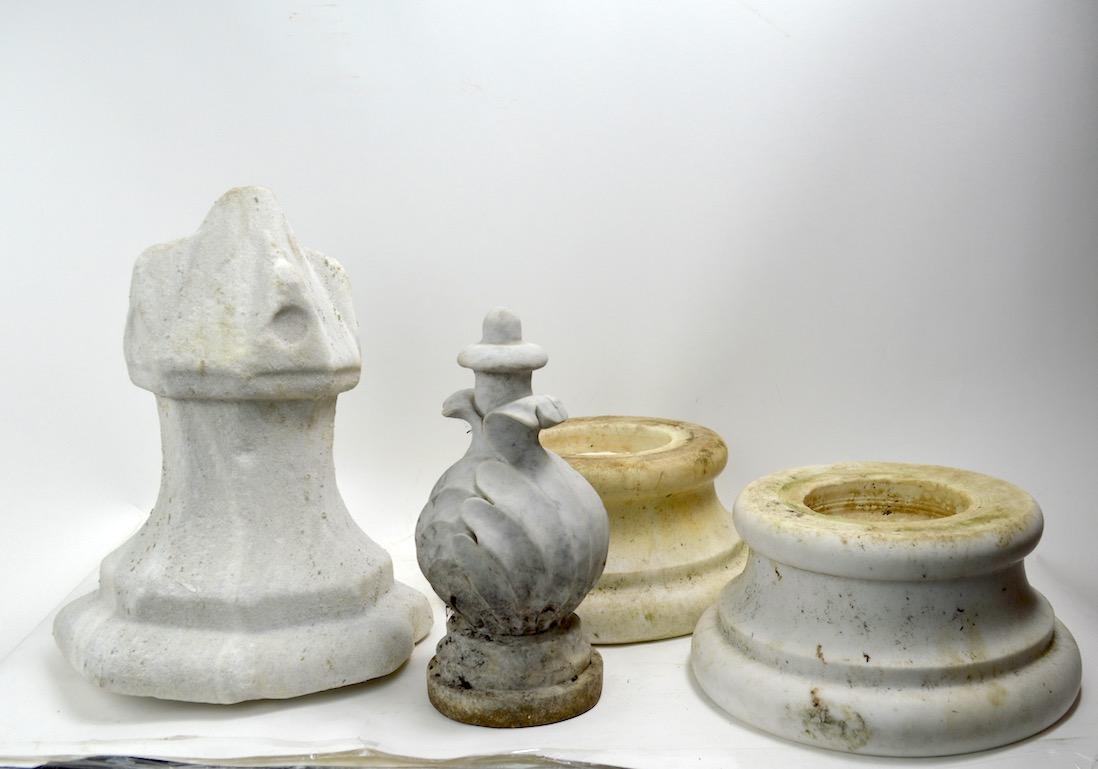 Group of four marble fragments to include two pedestal bases (9.5
