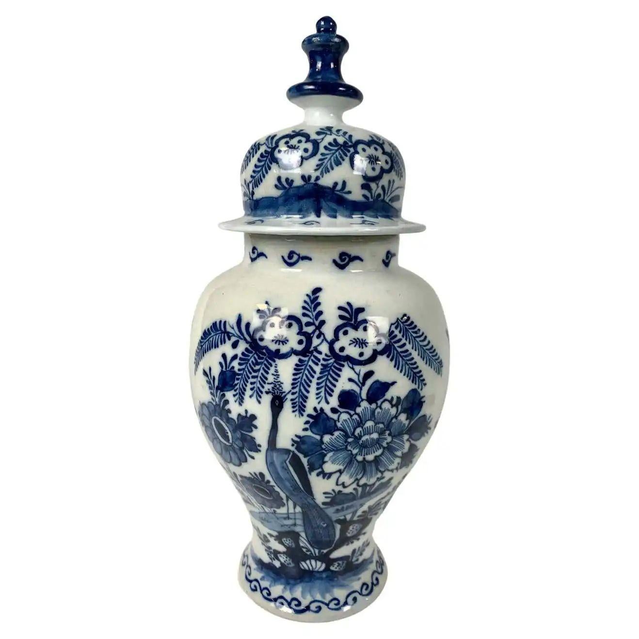 This is a group of blue and white Delft jars and vases and one carafe.
Made in the 18th century, each piece has its character.
Together, they form a gorgeous group.
Here are the details of each piece starting on the left:
1) A Blue and White Delft