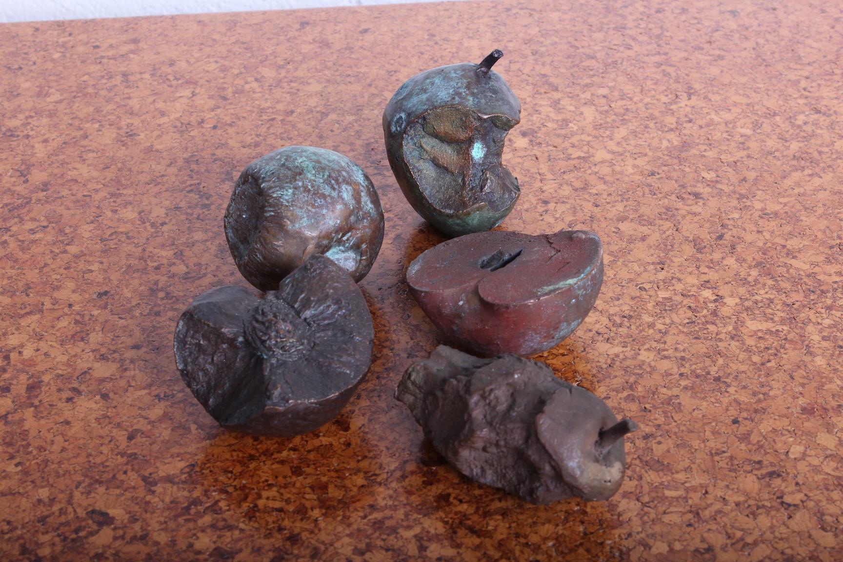 A beautifully patinated group of five single casting bronze fruit.
 