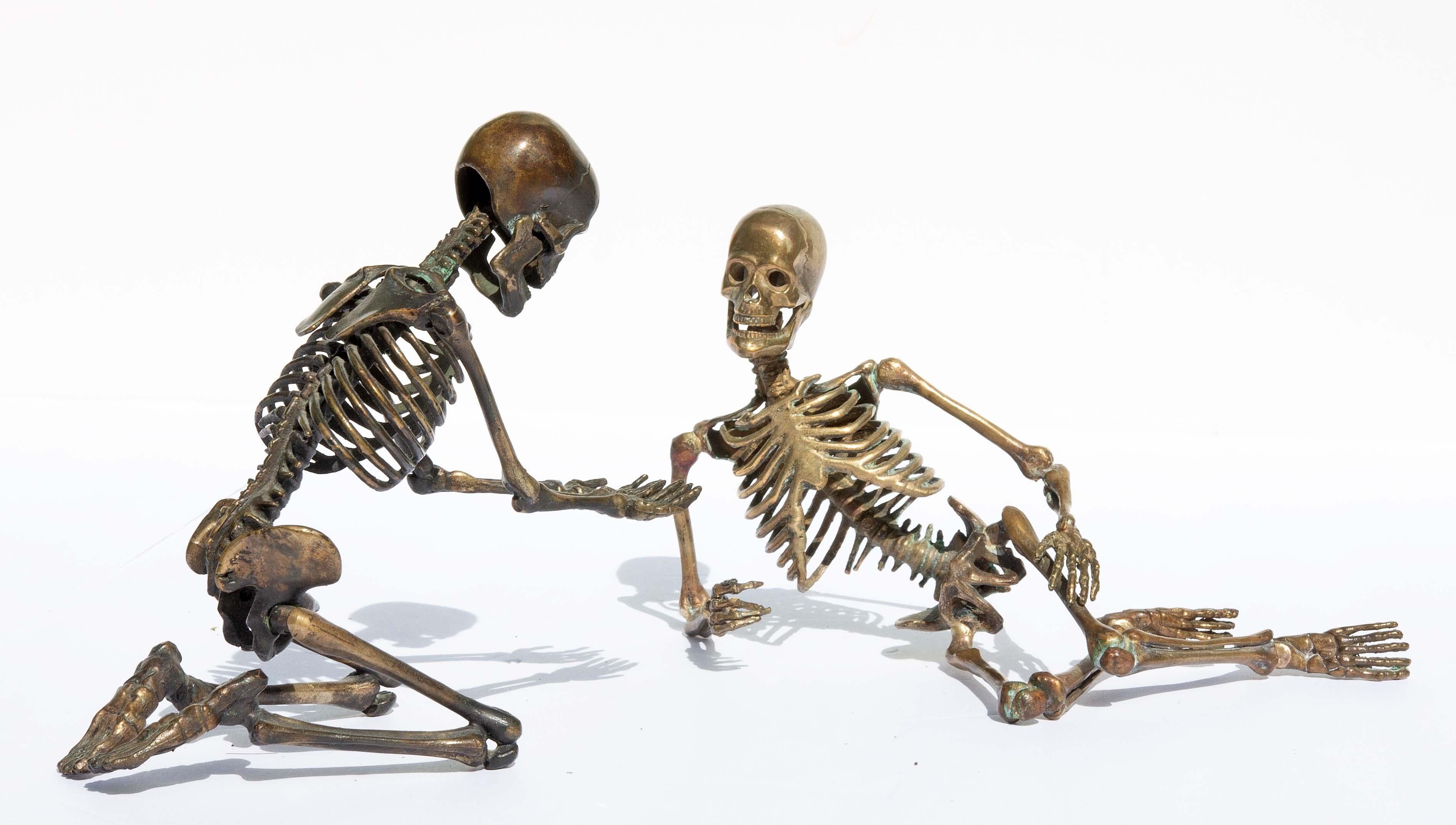 Group of bronze skeleton sculptures having a passionate conversation. Very detailed. The kneeling figure has working jaw. By American sculptor David W. Dempsey. Monogramed 