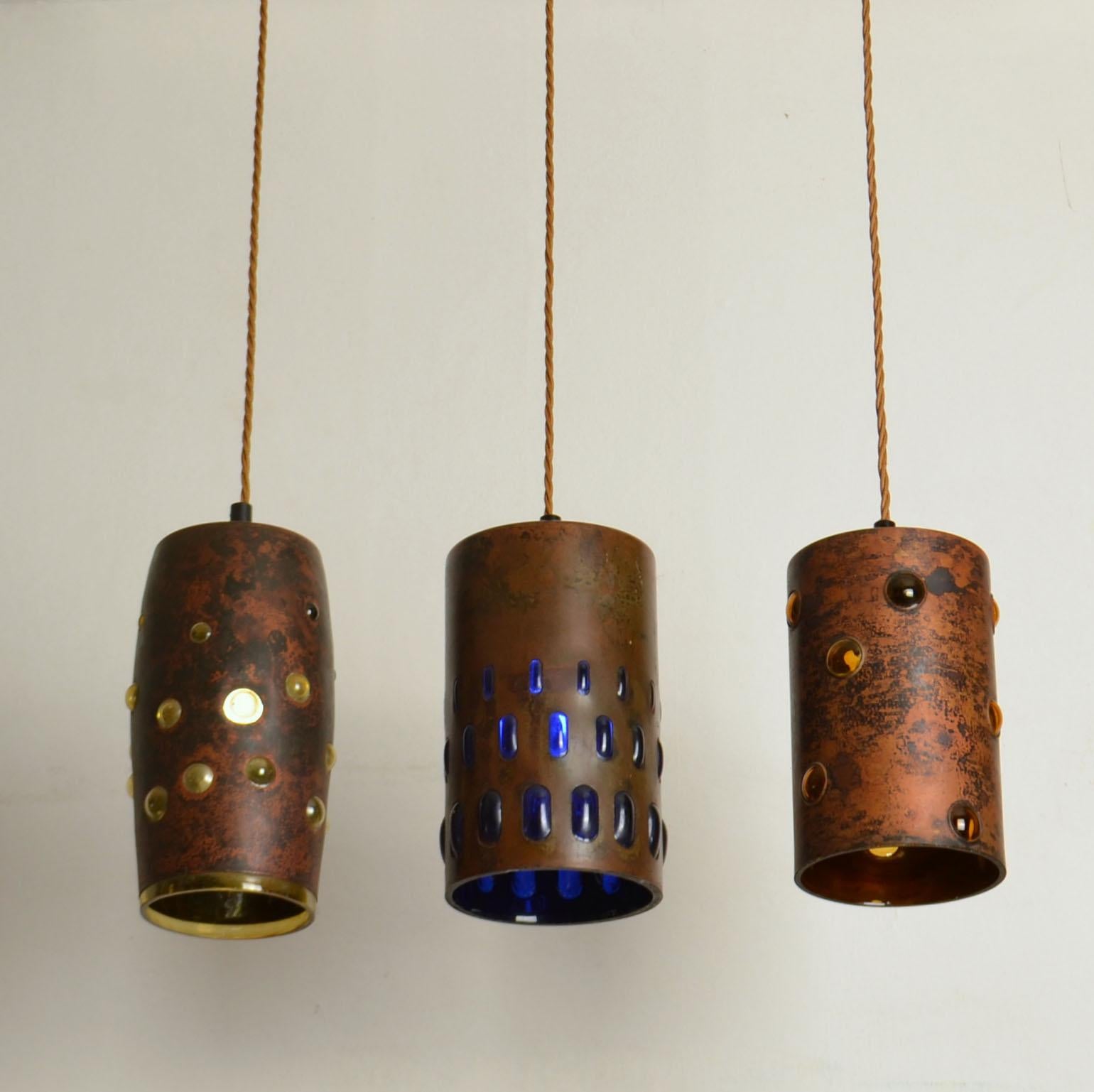 Mid-20th Century Group of Five Copper and Glass Pendant Lamps by Nanny Still for Raak