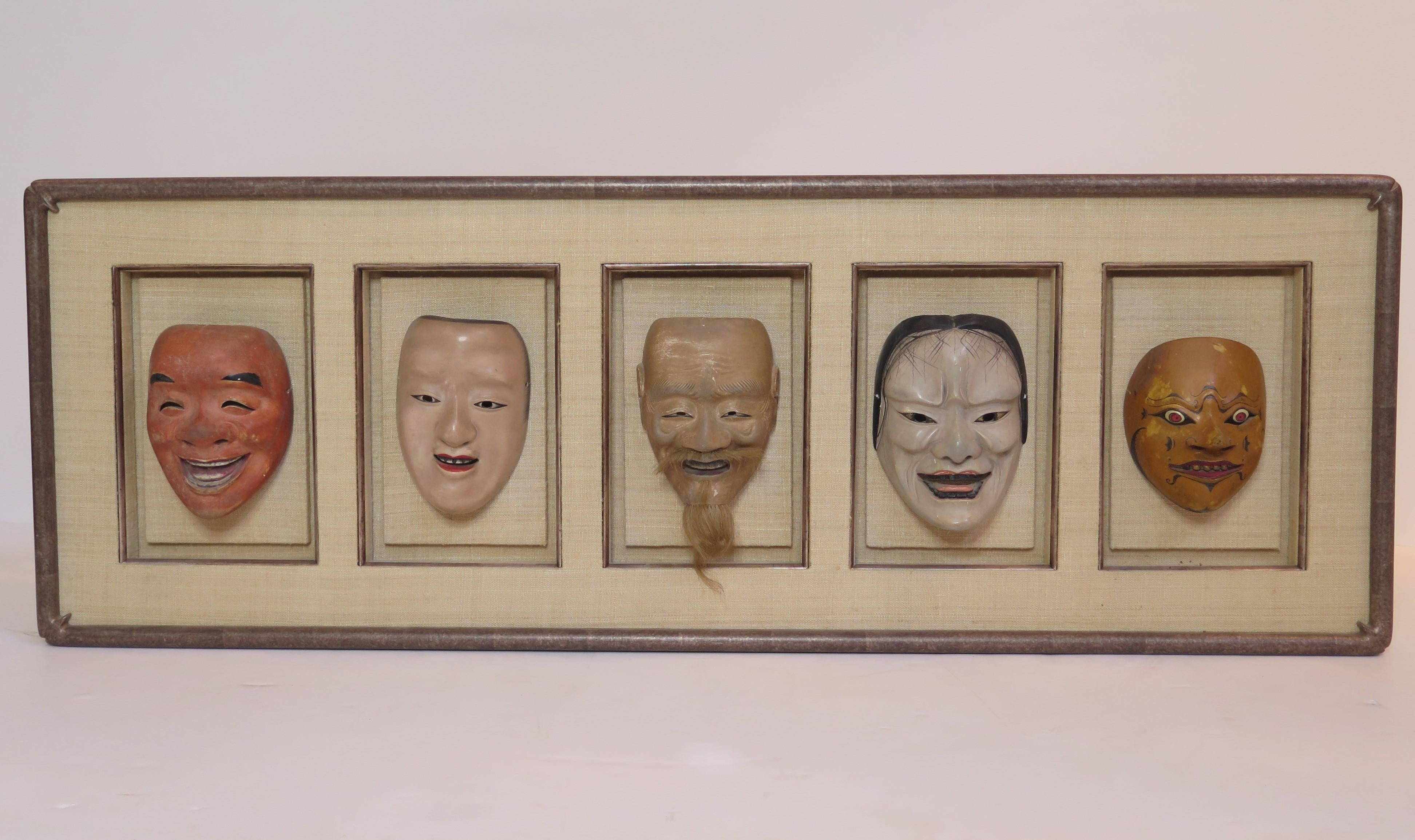 A group of five life size carved and painted Japanese Kabuki Theatre masks. They are framed as one unit in a shadow box manner with linen backing.

 Kabuki (???) is a classical Japanese dance-drama. Kabuki theatre is known for the stylization of
