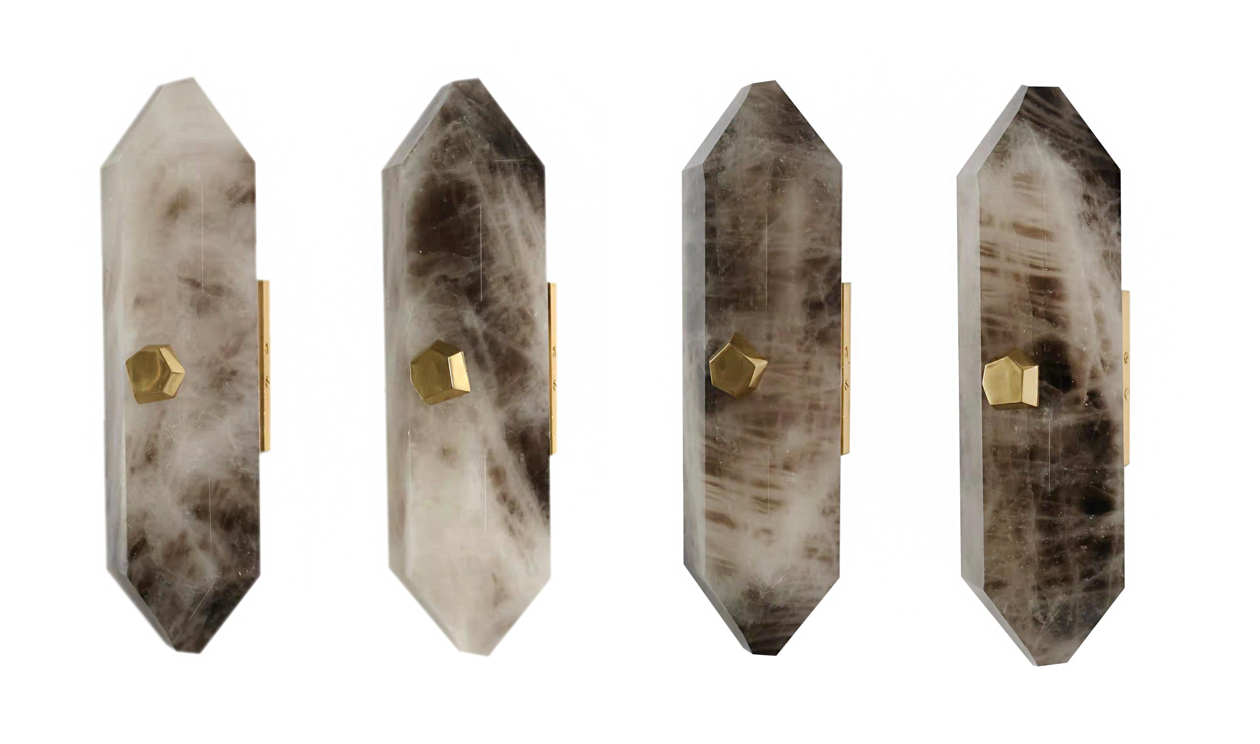 Group of four smokey diamond form rock crystal sconces with polished brass mounts. Each wall sconce installed two sockets, 60 watts max each socket, total 120-watt. Created by Phoenix Gallery NYC.
Custom size, finish, and quantity upon request.