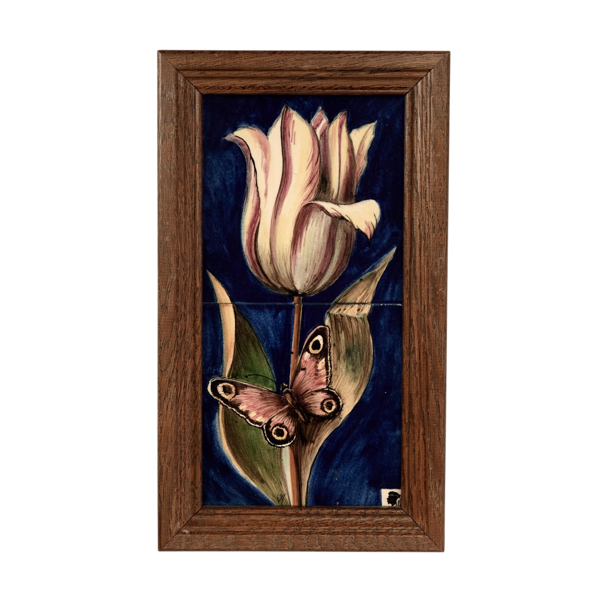 Striking group of four vintage framed tile wall art having two tiles in each frame with hand painted tulips butterflies and moths against an alluring blue background. Presented in wood frames and signed with a logo in the lower right. 