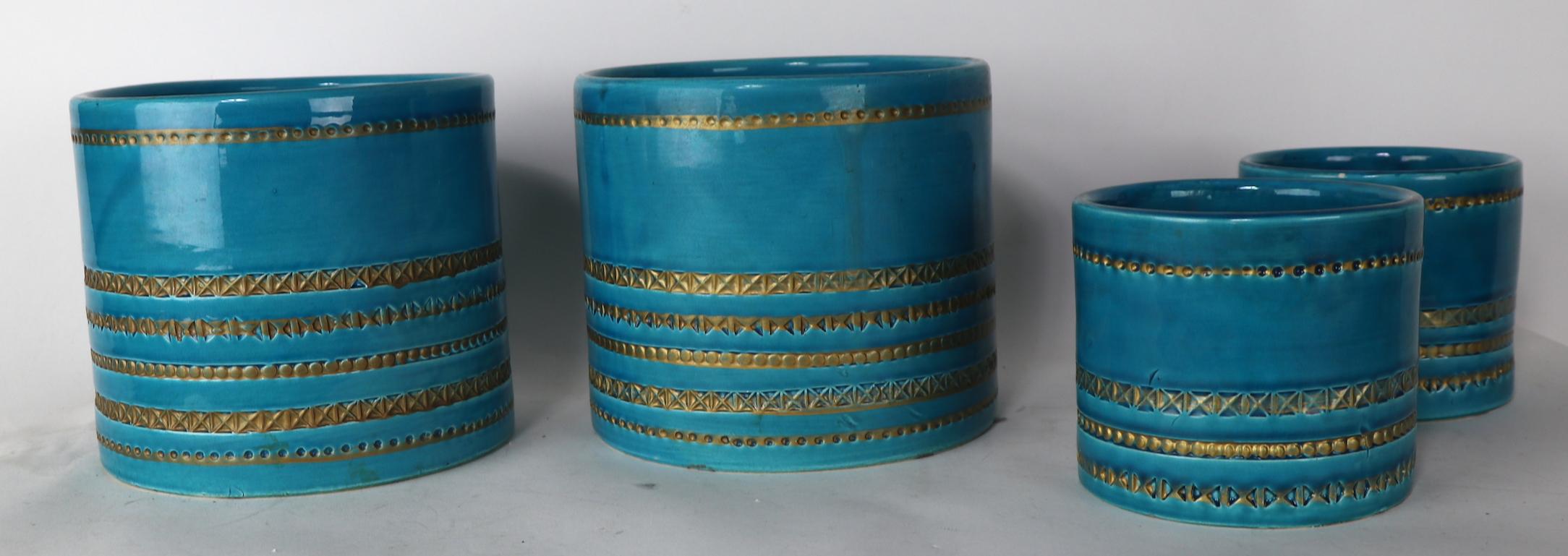 Group of four Italian pottery flower pots, two larger (6.25 height inches x 7 diameter) and two smaller (4.25 height x 5 diameter) the two smaller pots are marked on bottom, as shown. One small pot has insignificant glaze flake chip at top edge rim,
