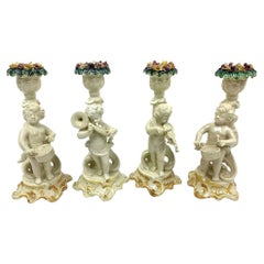 Group Of Four Italian Putti Della Robbia Style Candlesticks