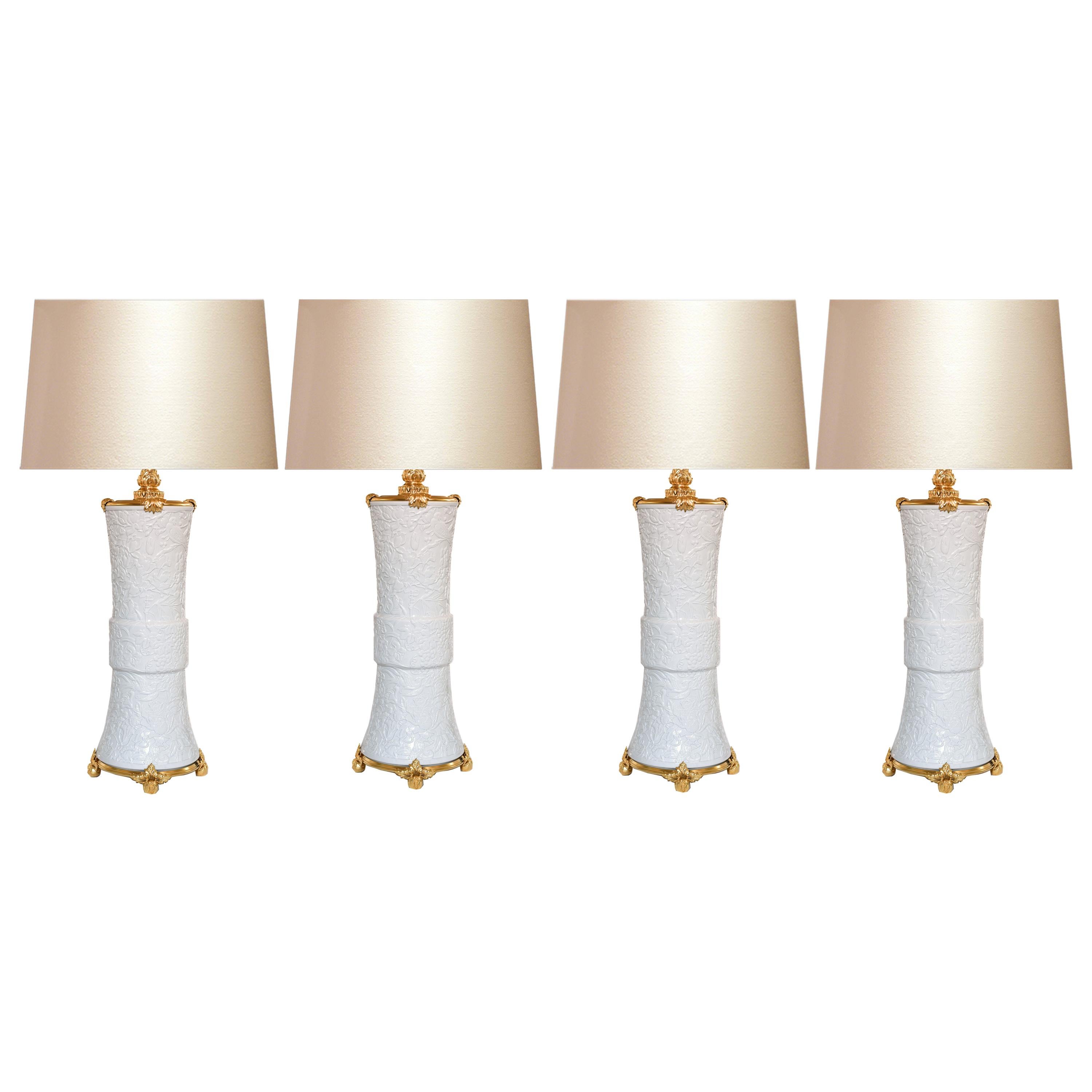 Gruppo di quattro lampade in porcellana con montatura in ormolu