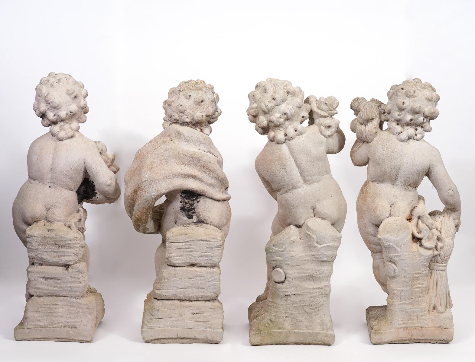 Group of Four Putti Cast Stone Garden Statues 'The Four Seasons', circa 1920 In Good Condition In Ft. Lauderdale, FL