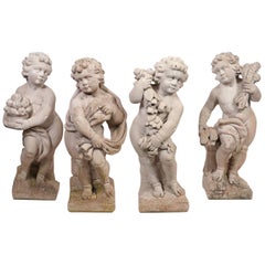 Gruppe von vier Gartenstatuen aus Putti-Gussstein 'Die vier Jahreszeiten':: um 1920