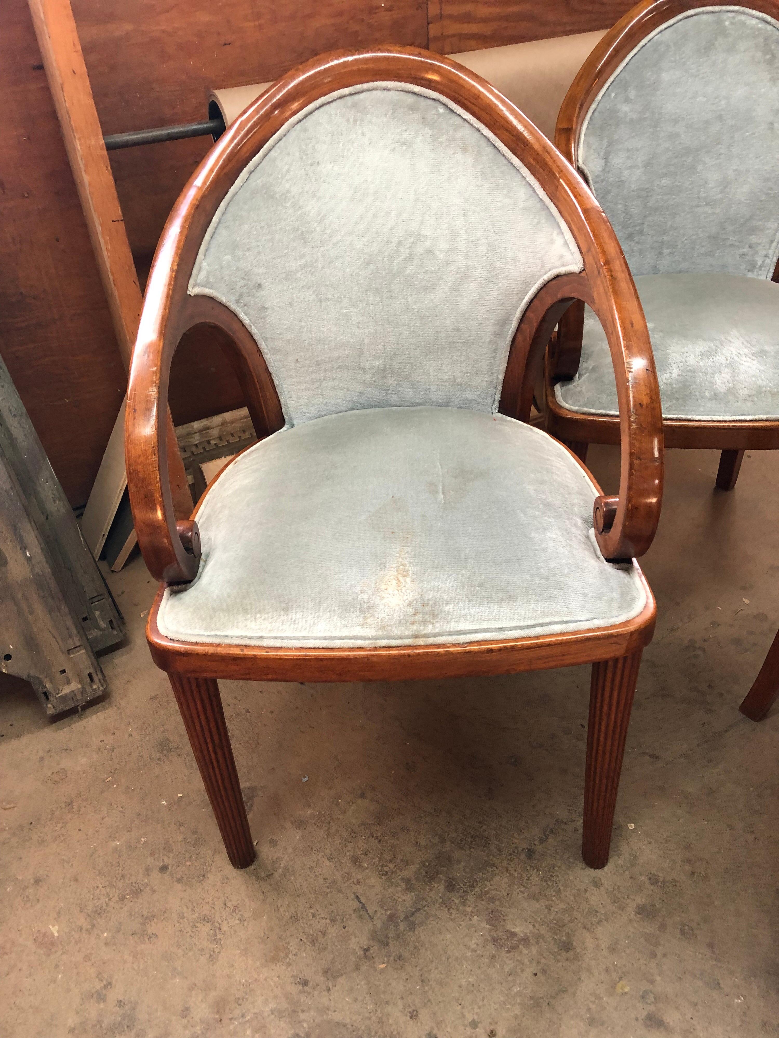 A set of four Austrian walnut upholstered dining chairs. Blue-gray velvet upholstery.
There are also a pair (2) matching chairs also available in addition to these four. They are mahogany, but exact same chair. Upholstered seat and back.