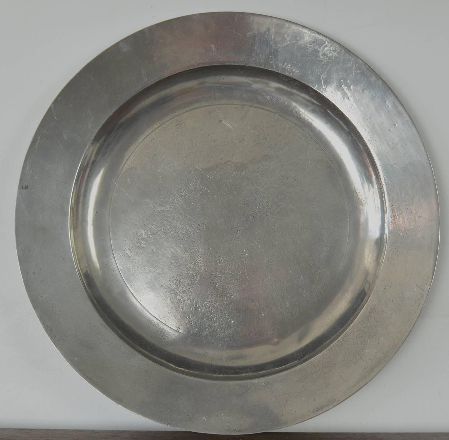 Wonderful group of 18th century polished English pewter chargers.

It gives them an almost Industrial look.

Useful as table coasters, trays or wall decorations.

They have been professionally polished front and back.

When polished pewter